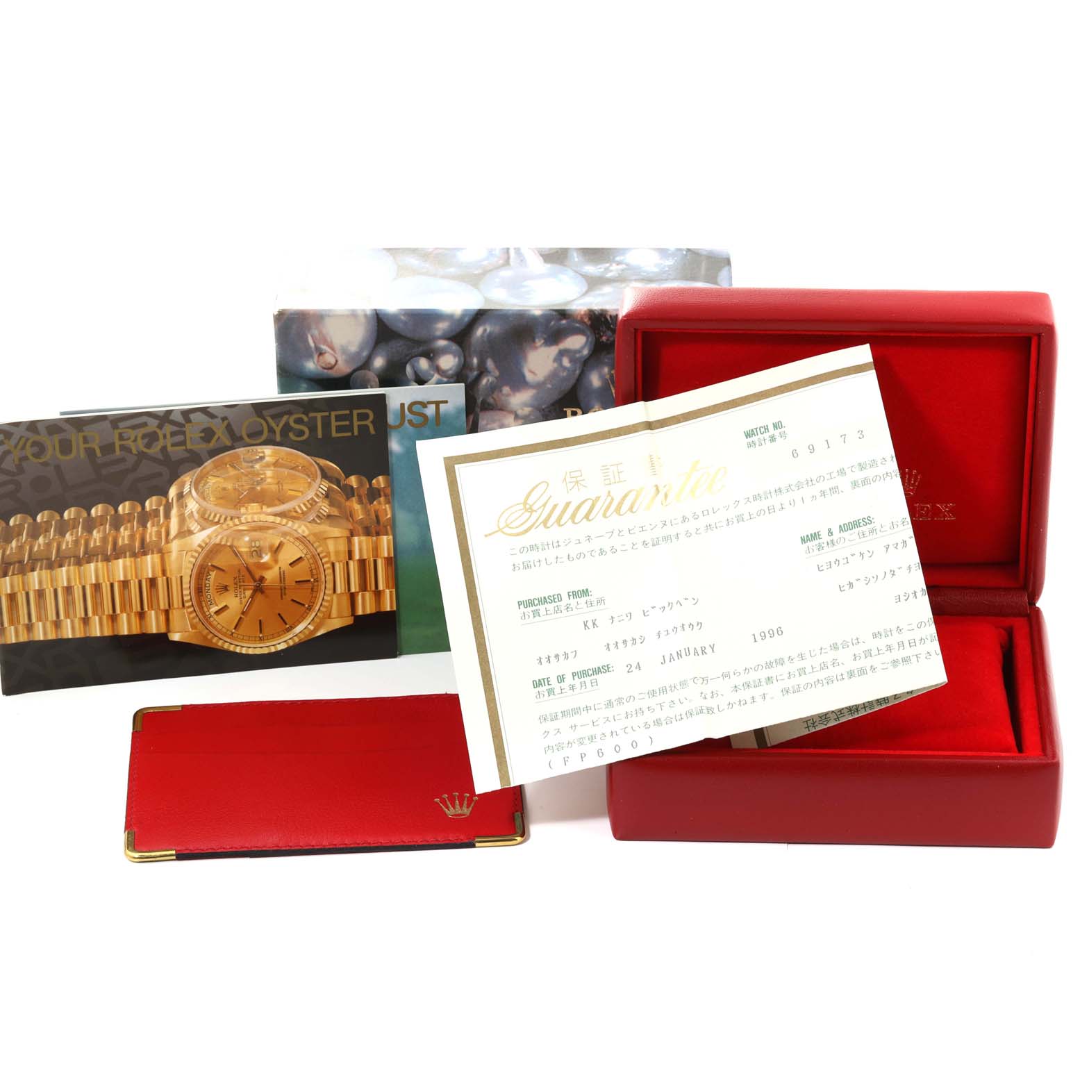 The image shows accessories including the box, papers, and a booklet for a Rolex Datejust 69173 Women's Steel and Gold (two tone) Champagne Dial 69173 Women's Steel and Gold (two tone) Champagne Dial watch.