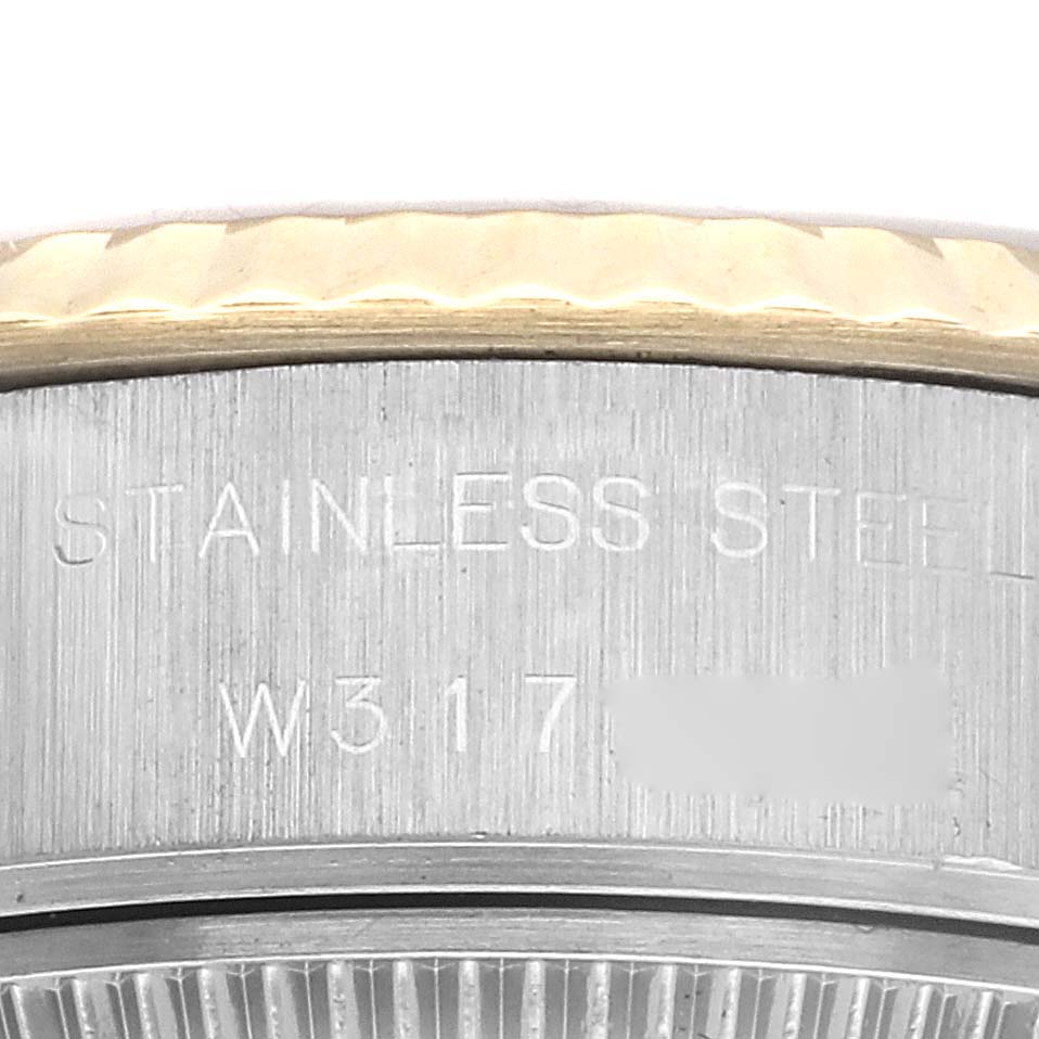 The image shows a close-up of the side engraving on the case back of the Rolex Datejust 69173 Women's Steel and Gold (two tone) Champagne Dial 69173 Women's Steel and Gold (two tone) Champagne Dial watch, highlighting the "STAINLESS STEEL" inscription.