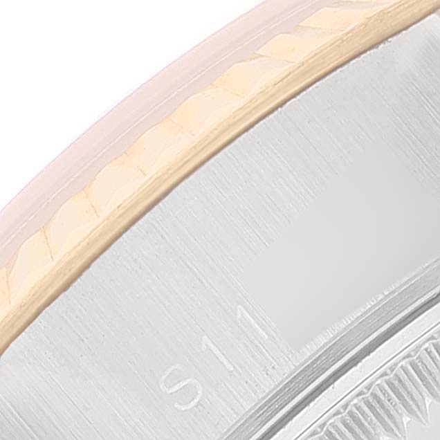 The image shows a close-up of the stainless steel and gold bezel edge on a Rolex Datejust 69173 Women's Steel and Gold (two tone) Beige Dial 69173 Women's Steel and Gold (two tone) Beige Dial watch.
