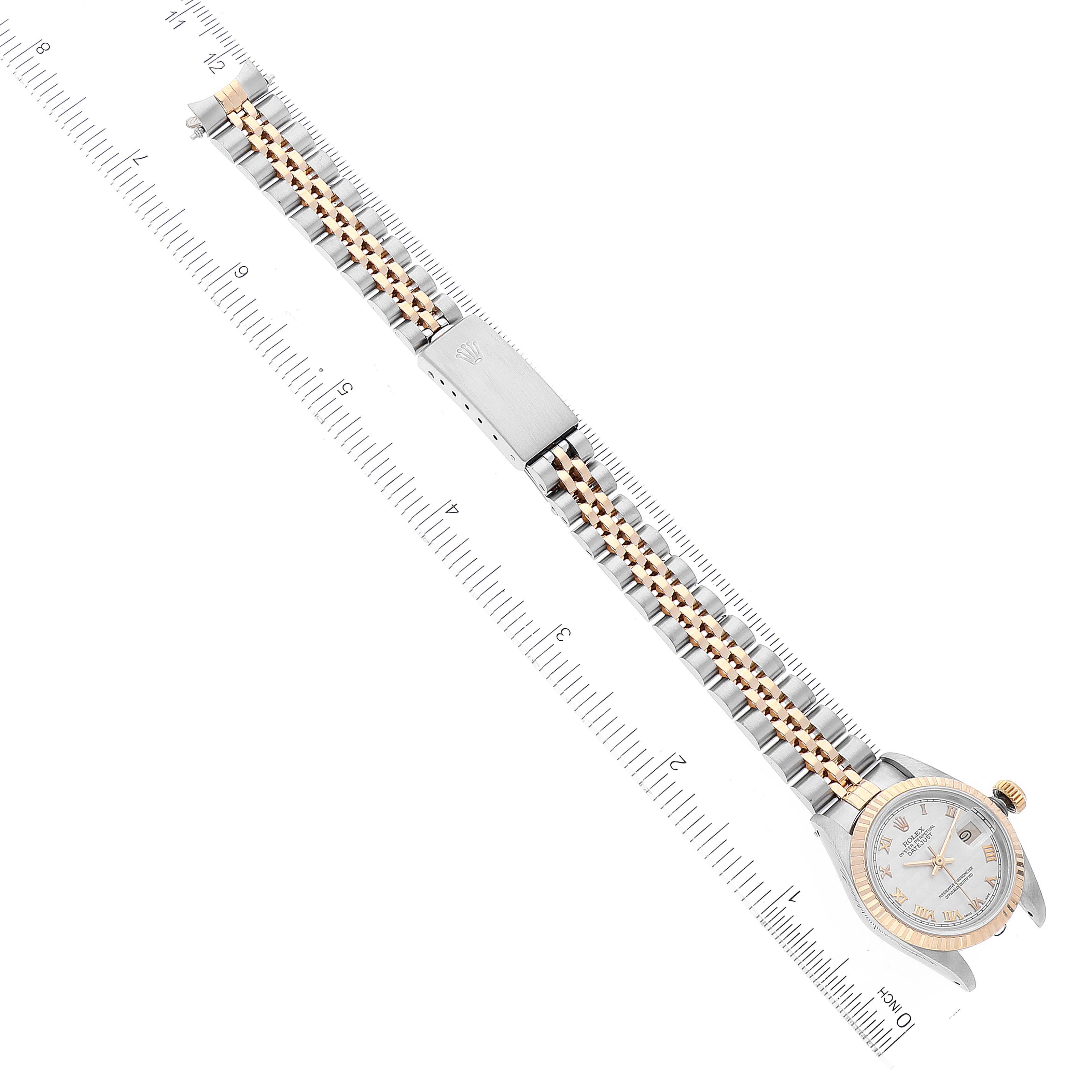 The image shows the Rolex Datejust 69173 Women's Steel and Gold (two tone) Beige Dial 69173 Women's Steel and Gold (two tone) Beige Dial watch viewed from above, highlighting its face, bezel, and two-tone bracelet with a ruler for scale.