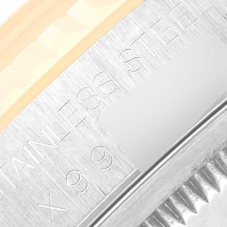 The image shows a close-up angle of the bezel and part of the case of a Rolex Datejust 16233 Men's Steel and Gold (two tone) Beige Dial 16233 Men's Steel and Gold (two tone) Beige Dial watch, highlighting the text "STAINLESS STEEL."