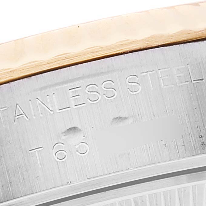 This image shows a close-up of the stainless steel casing and part of the bezel of a Rolex Datejust 69173 Women's Steel and Gold (two tone) Mother of Pearl Dial 69173 Women's Steel and Gold (two tone) Mother of Pearl Dial watch.