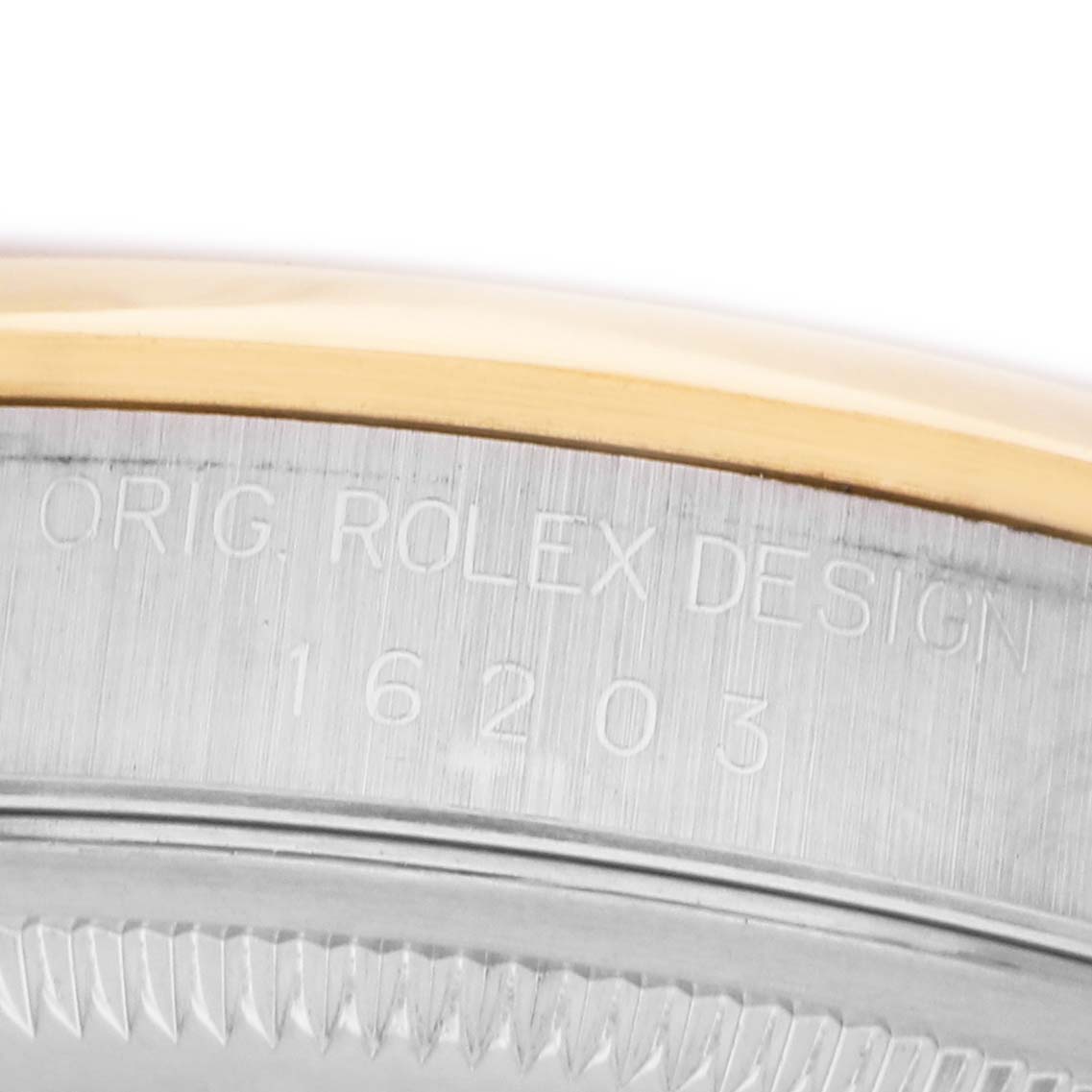The image shows a close-up of the side of a Rolex Datejust 16203 Men's Steel and Gold (two tone) Silver Dial watch, focusing on engraved model details.