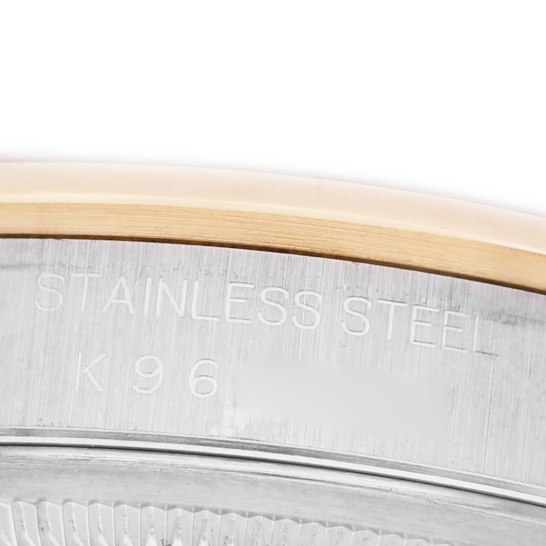 The image shows a close-up of the case back of a Rolex Datejust 16203 Men's Steel and Gold (two tone) Silver Dial, featuring the stainless steel inscription.