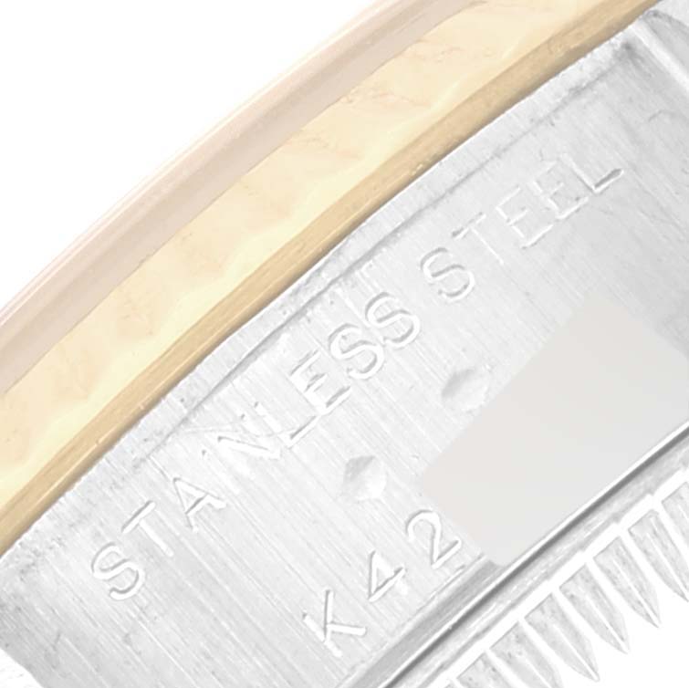 The image shows a close-up of the stainless steel casing with engraved markings on a Rolex Datejust 79173 Women's Steel and Gold (two tone) White Dial 79173 Women's Steel and Gold (two tone) White Dial watch.