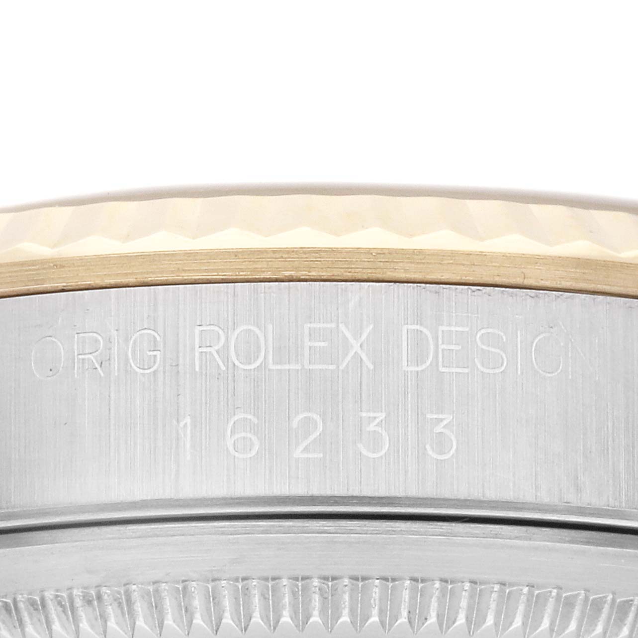 The image shows a close-up of the side engraving on a Rolex Datejust 16233 Men's Steel and Gold (two tone) White Dial 16233 Men's Steel and Gold (two tone) White Dial watch, featuring the model number 16233.