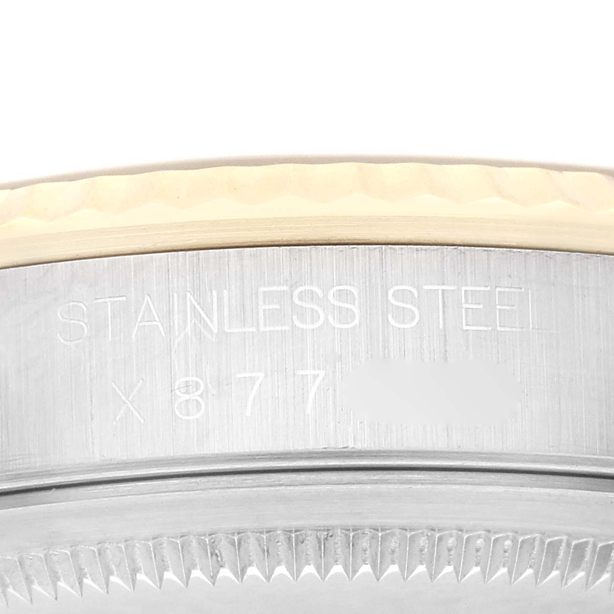 The image shows a close-up view of the side engraving on a Rolex Datejust 16233 Men's Steel and Gold (two tone) White Dial 16233 Men's Steel and Gold (two tone) White Dial watch, focusing on the stainless steel part.