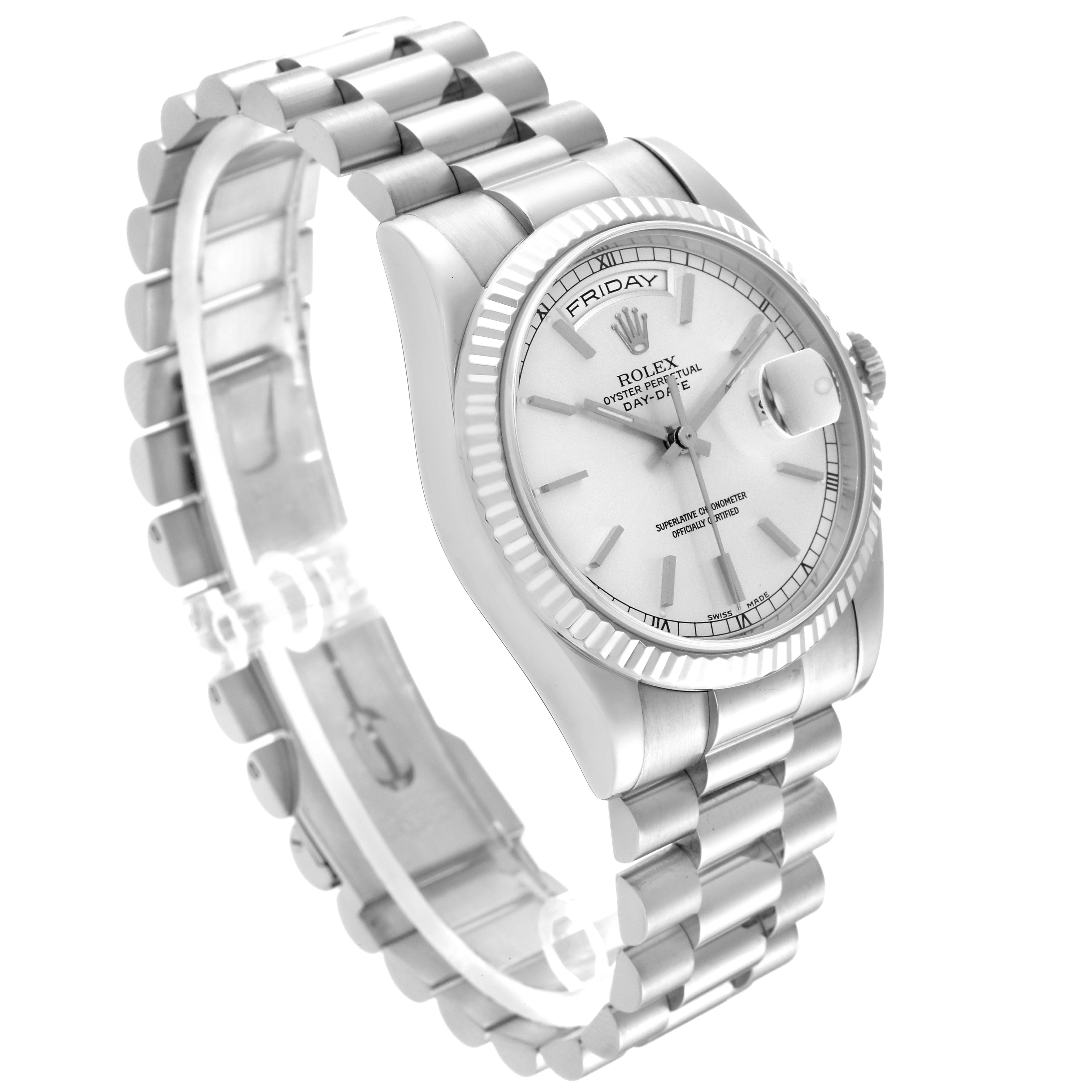 The Rolex President OFFICIALLY CERTIFIED CHRONOMETER SELF-WINDING MOVEMENT. Men's White Gold Silver Dial OFFICIALLY CERTIFIED CHRONOMETER SELF-WINDING MOVEMENT. Men's White Gold Silver Dial model is shown in a side angle, displaying its bracelet, crown, and face with day and date features.