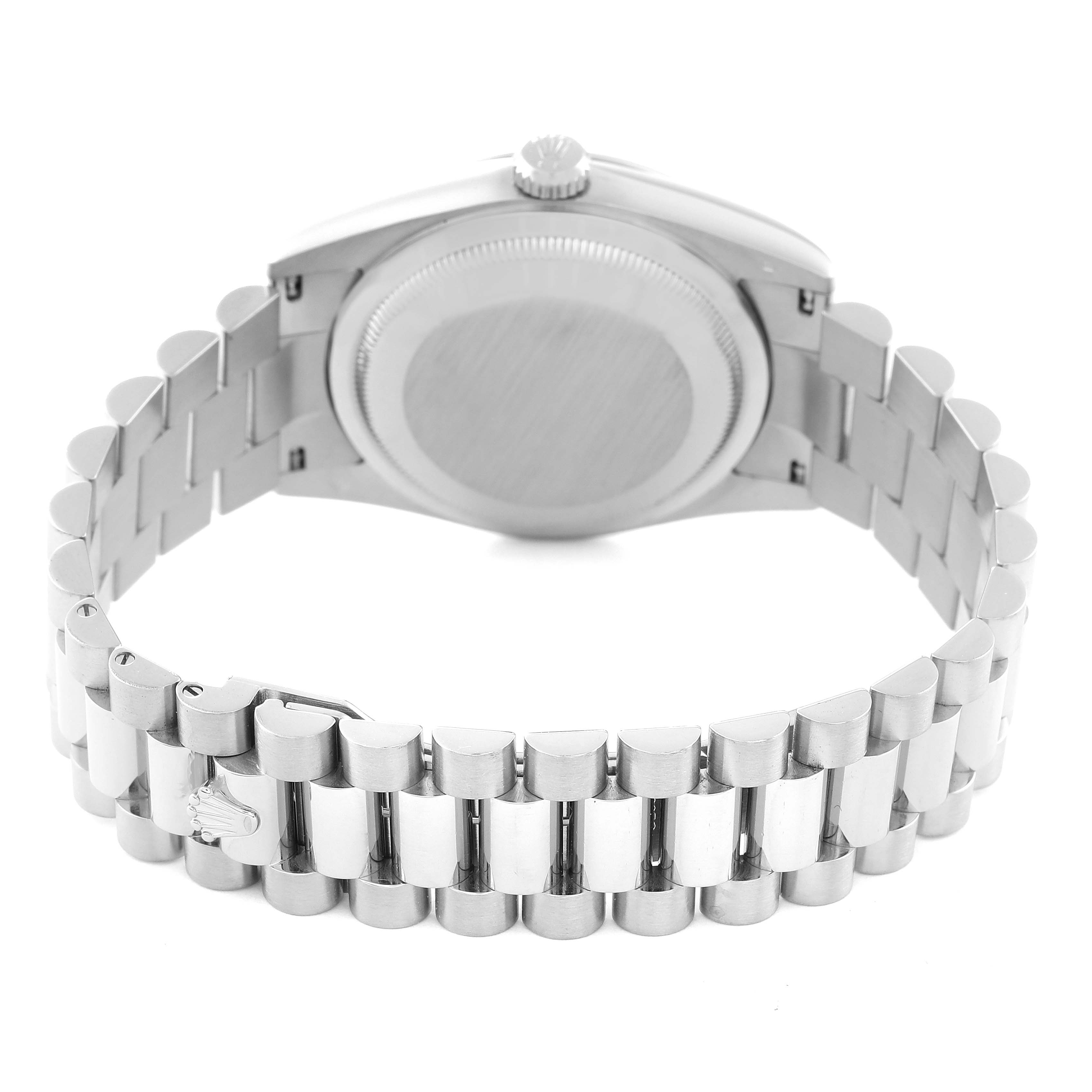 This image shows the back case and bracelet of a Rolex President OFFICIALLY CERTIFIED CHRONOMETER SELF-WINDING MOVEMENT. Men's White Gold Silver Dial OFFICIALLY CERTIFIED CHRONOMETER SELF-WINDING MOVEMENT. Men's White Gold Silver Dial model watch from a rear angle.