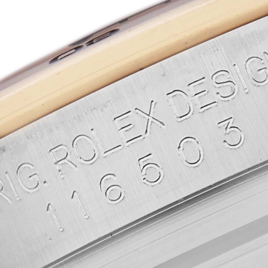 The image shows a close-up of the engraved edge of a Rolex Daytona 116503 Men
s Steel and Gold (two tone) Mother of Pearl Dial 116503 Men
s Steel and Gold (two tone) Mother of Pearl Dial, highlighting the model number.