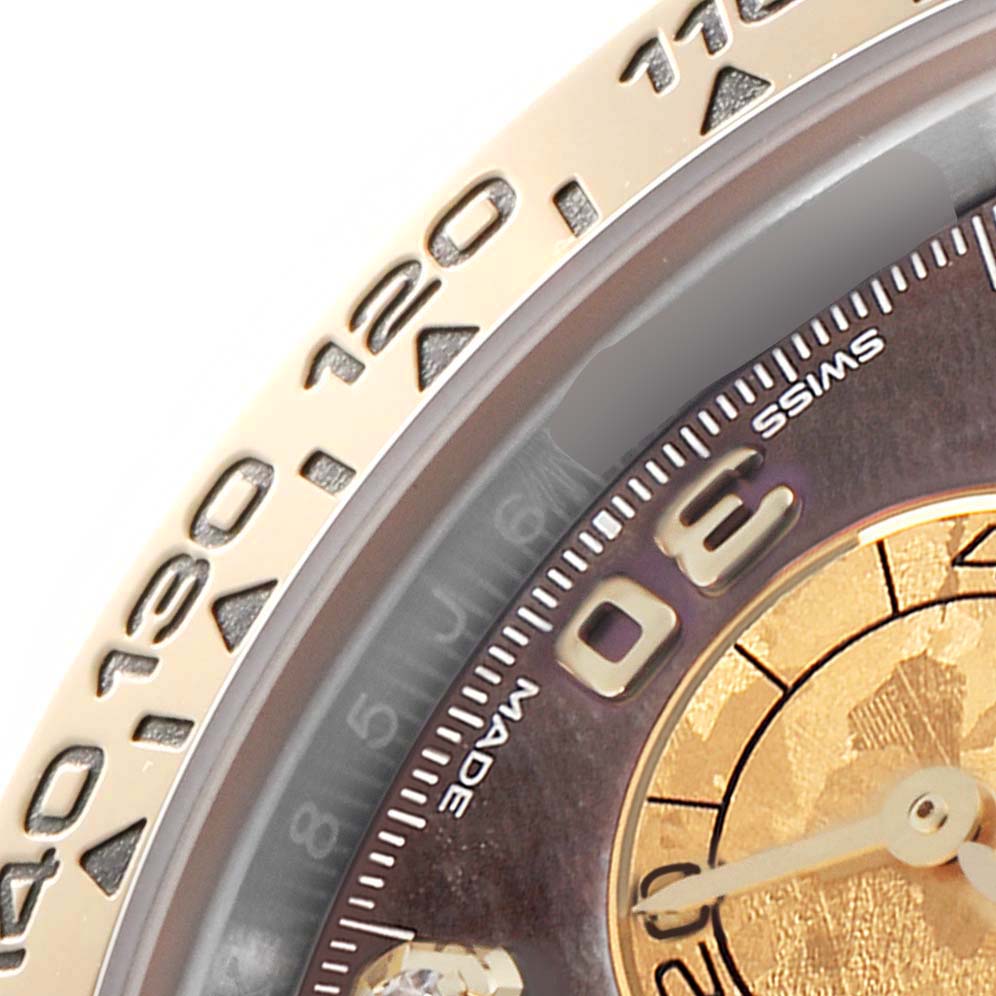 The image shows a partial view of the Rolex Daytona 116503 Men
s Steel and Gold (two tone) Mother of Pearl Dial 116503 Men
s Steel and Gold (two tone) Mother of Pearl Dial watch face, highlighting the bezel with engraved numbers and part of the dial.