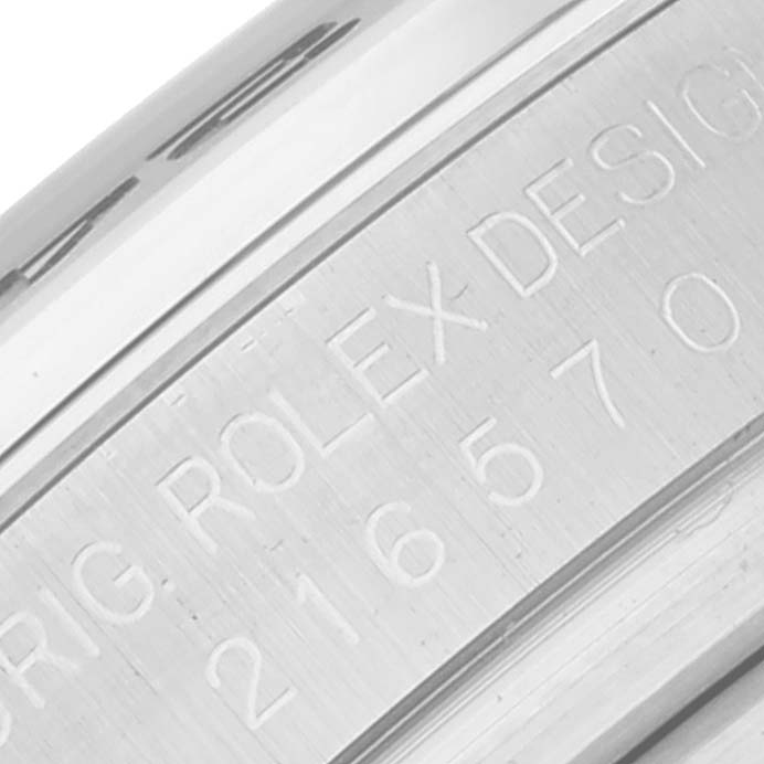The image shows a close-up of the engravings on the side of a Rolex Explorer 216570 Men's Stainless Steel Black Dial 216570 Men's Stainless Steel Black Dial watch case.