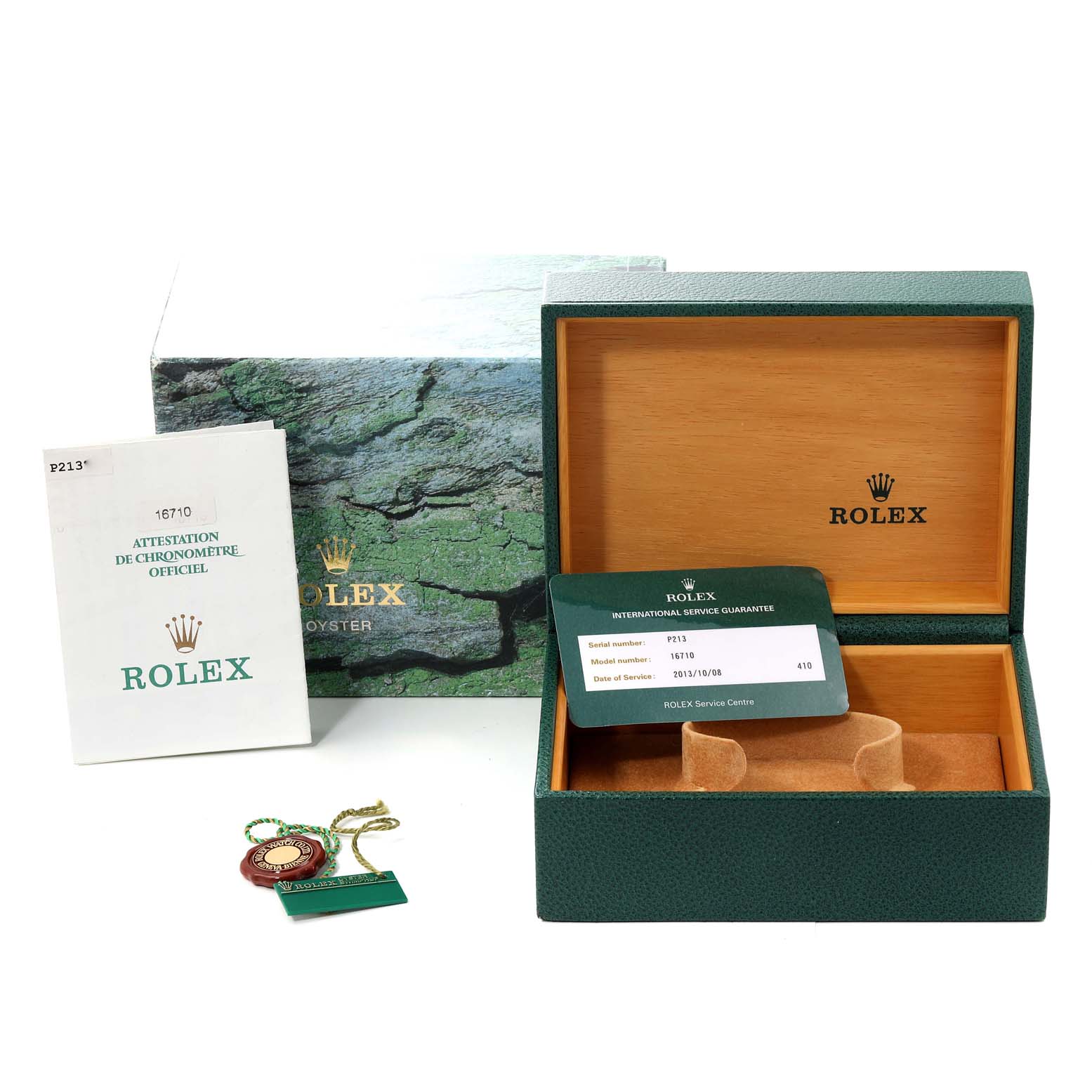 This image shows the box, booklet, tag, and warranty card for a Rolex GMT-Master 16710 Men
s Stainless Steel Black Dial 16710 Men
s Stainless Steel Black Dial watch.