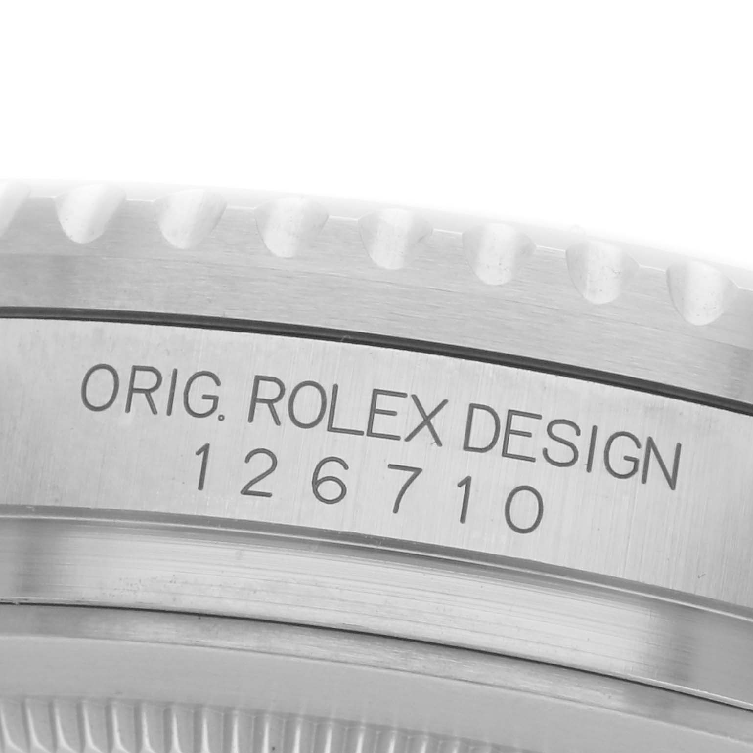 The image shows a close-up of the case side of a Rolex GMT-Master 126710GRNR Men
s Stainless Steel Black Dial 126710GRNR Men
s Stainless Steel Black Dial model, displaying the engraved model number "126710."