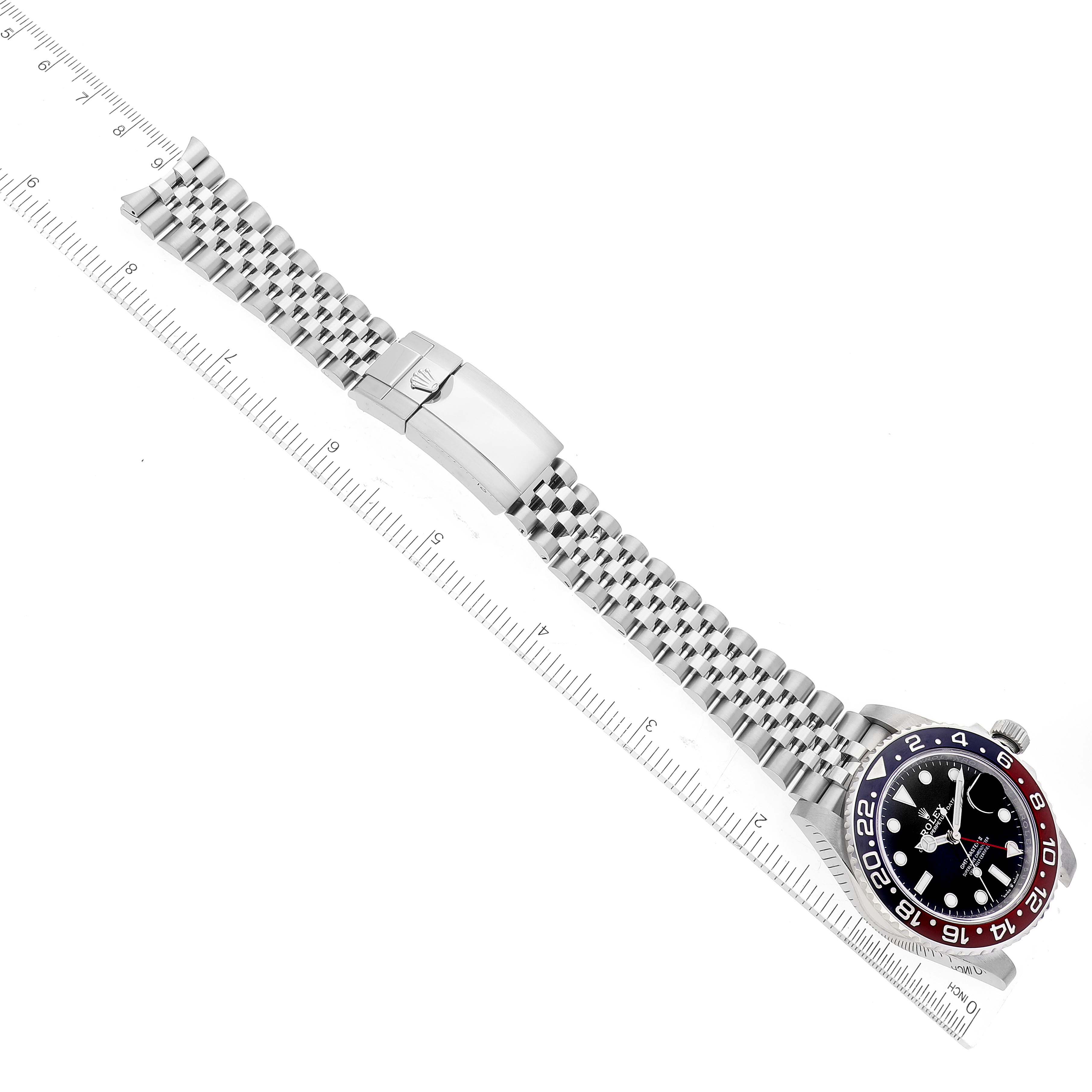 The image shows a top-down view of a Rolex GMT-Master 126710 Men
s Stainless Steel Black Dial 126710 Men
s Stainless Steel Black Dial watch with its bezel, dial, bracelet, and clasp visible.