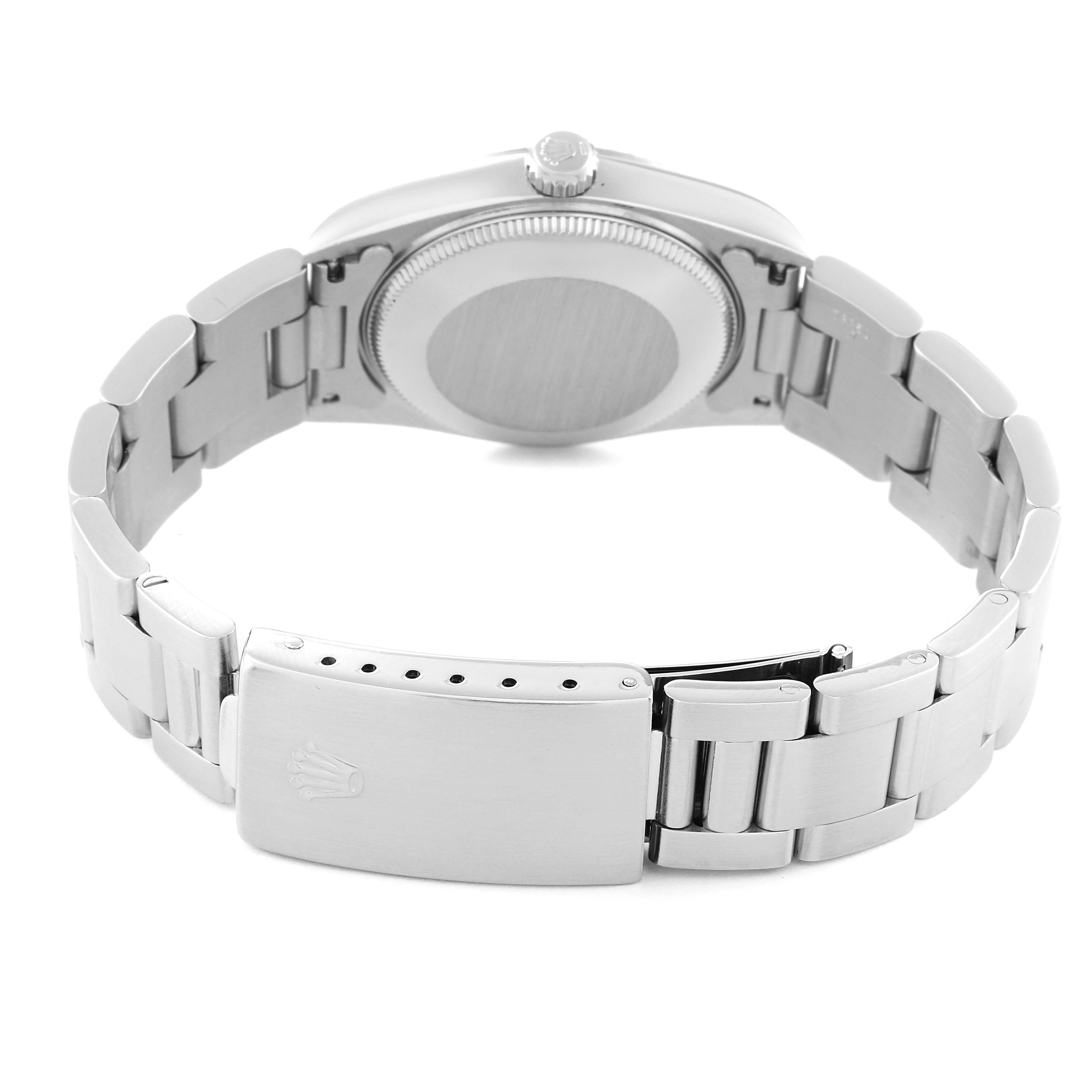 The image shows the back case and the clasp of a Rolex Mid-Size 67514 Women
s Stainless Steel Blue Dial 67514 Women
s Stainless Steel Blue Dial model watch from a rear angle.