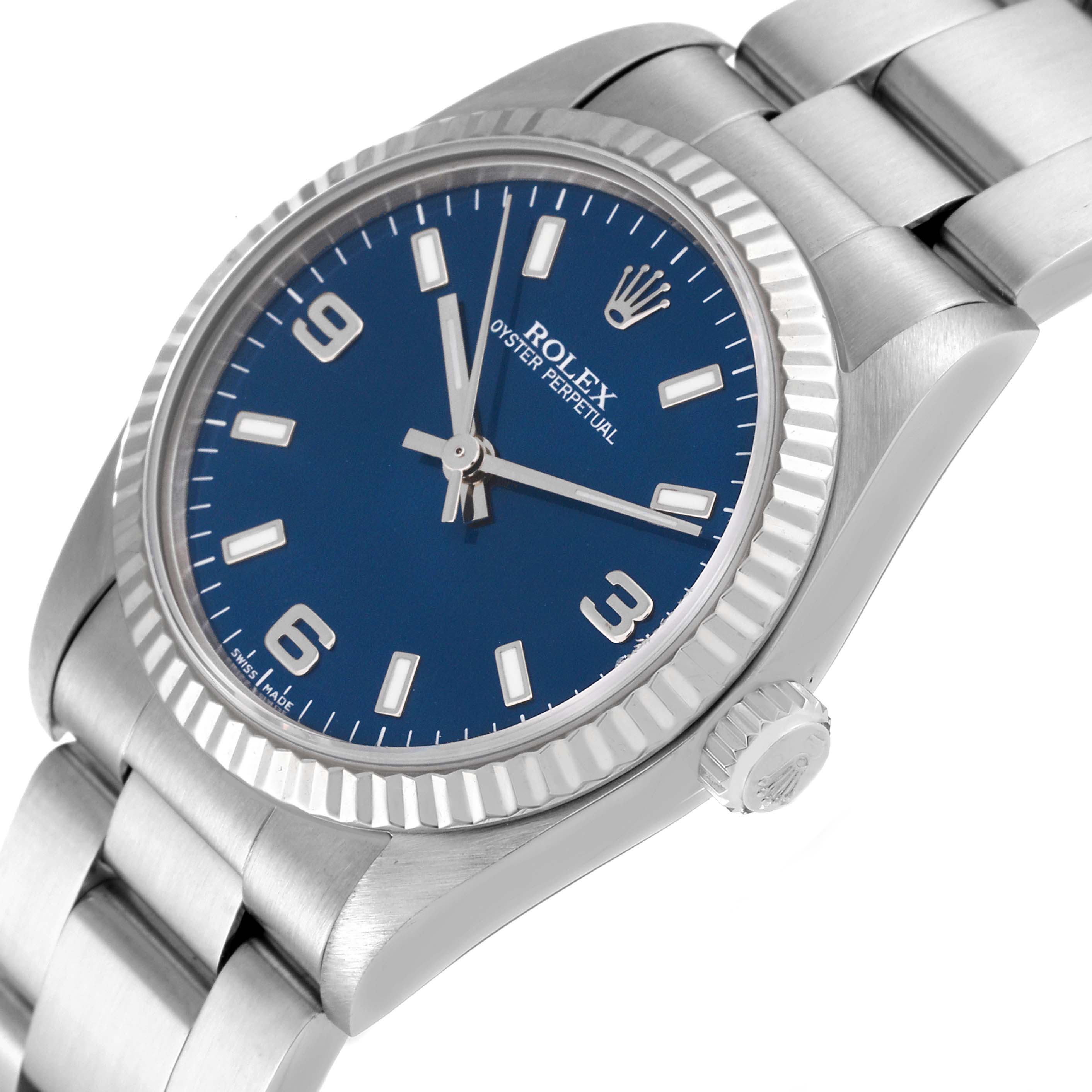 This image shows the front view of a Rolex Oyster Perpetual Mid-Size watch, featuring a blue dial and silver bracelet.