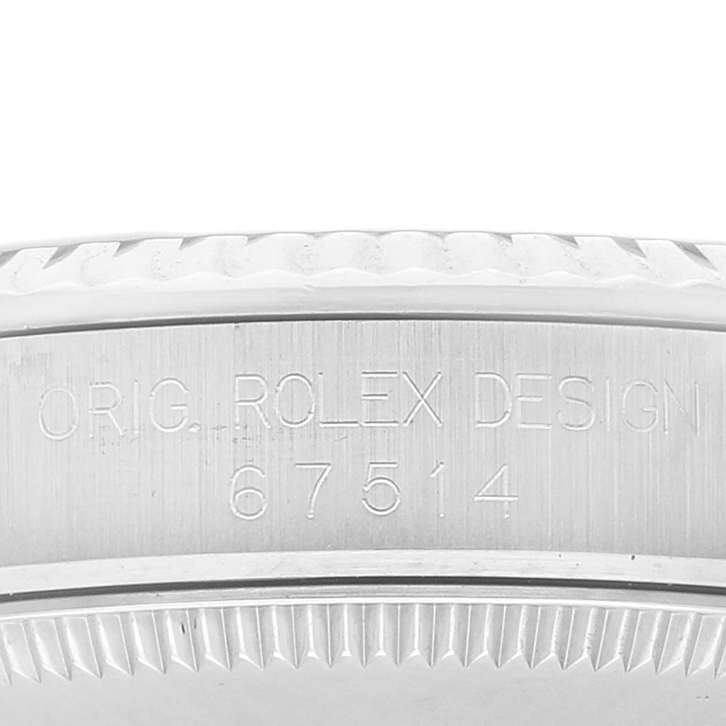 The image shows a close-up of the side casing and bezel of a Mid-Size Rolex watch with engraving.