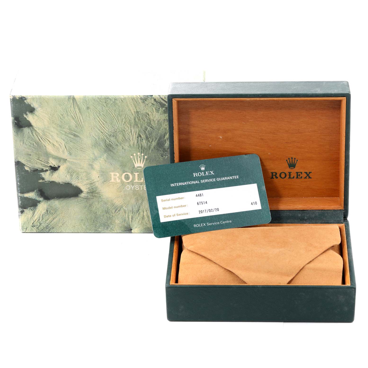 The image shows a Rolex Mid-Size 67514 Women
s Stainless Steel Blue Dial 67514 Women
s Stainless Steel Blue Dial model box, warranty card, and outer packaging from a slightly elevated front angle.