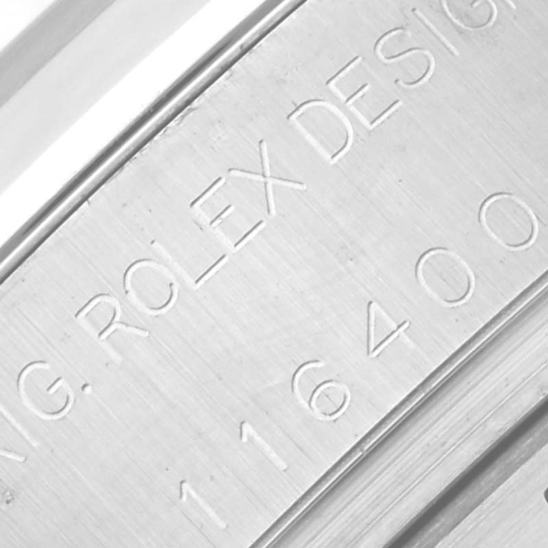This close-up image shows the engraved caseback of a Rolex Milgauss 116400 Men's Stainless Steel White Dial 116400 Men's Stainless Steel White Dial watch, highlighting its serial number and "ROLEX DESIGN" text.
