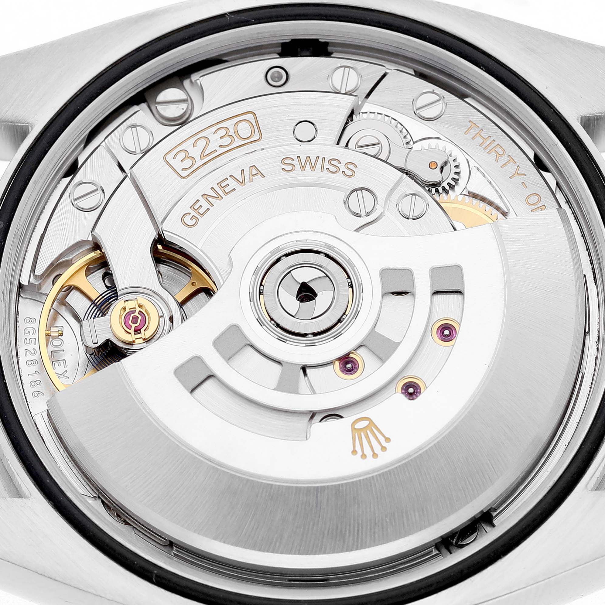 The image shows the movement of a Rolex Oyster Perpetual 126000 Men's Stainless Steel Silver Dial watch, highlighting its intricate internal mechanics.