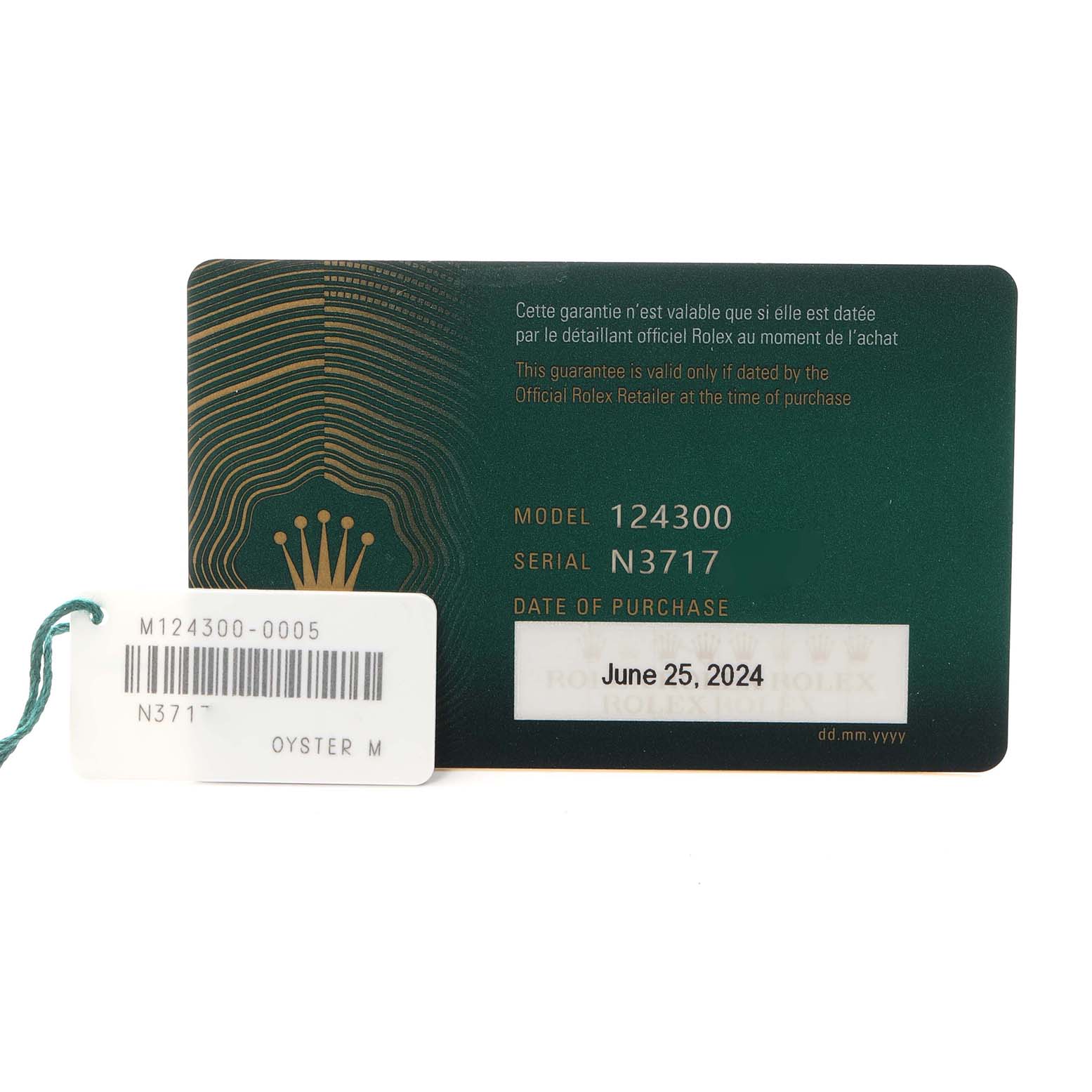 The image shows a warranty card and tag for the Rolex Oyster Perpetual 124300 Men
s Stainless Steel Green Dial 124300 Men
s Stainless Steel Green Dial, model 124300.