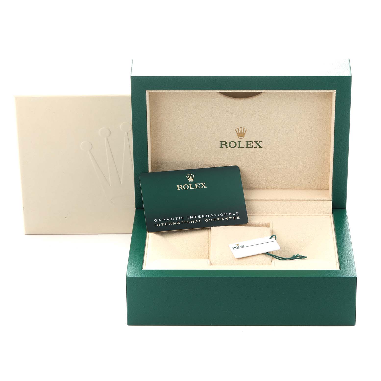 The image shows a green Rolex box, guarantee card, and tag for the Oyster Perpetual model.