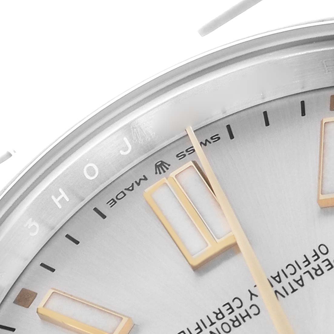 The image shows a close-up of the dial and bezel of a Rolex Oyster Perpetual 124300 Men
s Stainless Steel Silver Dial 124300 Men
s Stainless Steel Silver Dial, focusing on the hour markers and text.
