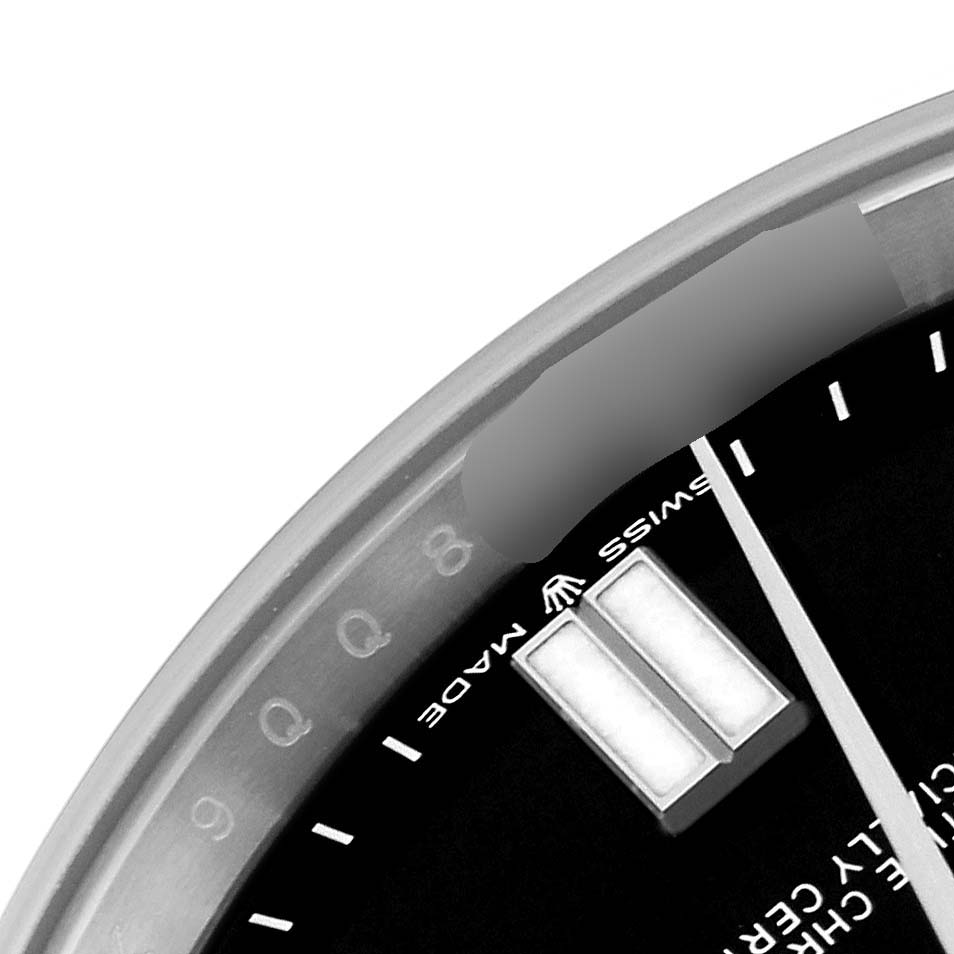 This image shows a close-up of the dial edge, hands, and hour markers of a Rolex Oyster Perpetual 124300 Men's Stainless Steel Black Dial 124300 Men's Stainless Steel Black Dial watch.