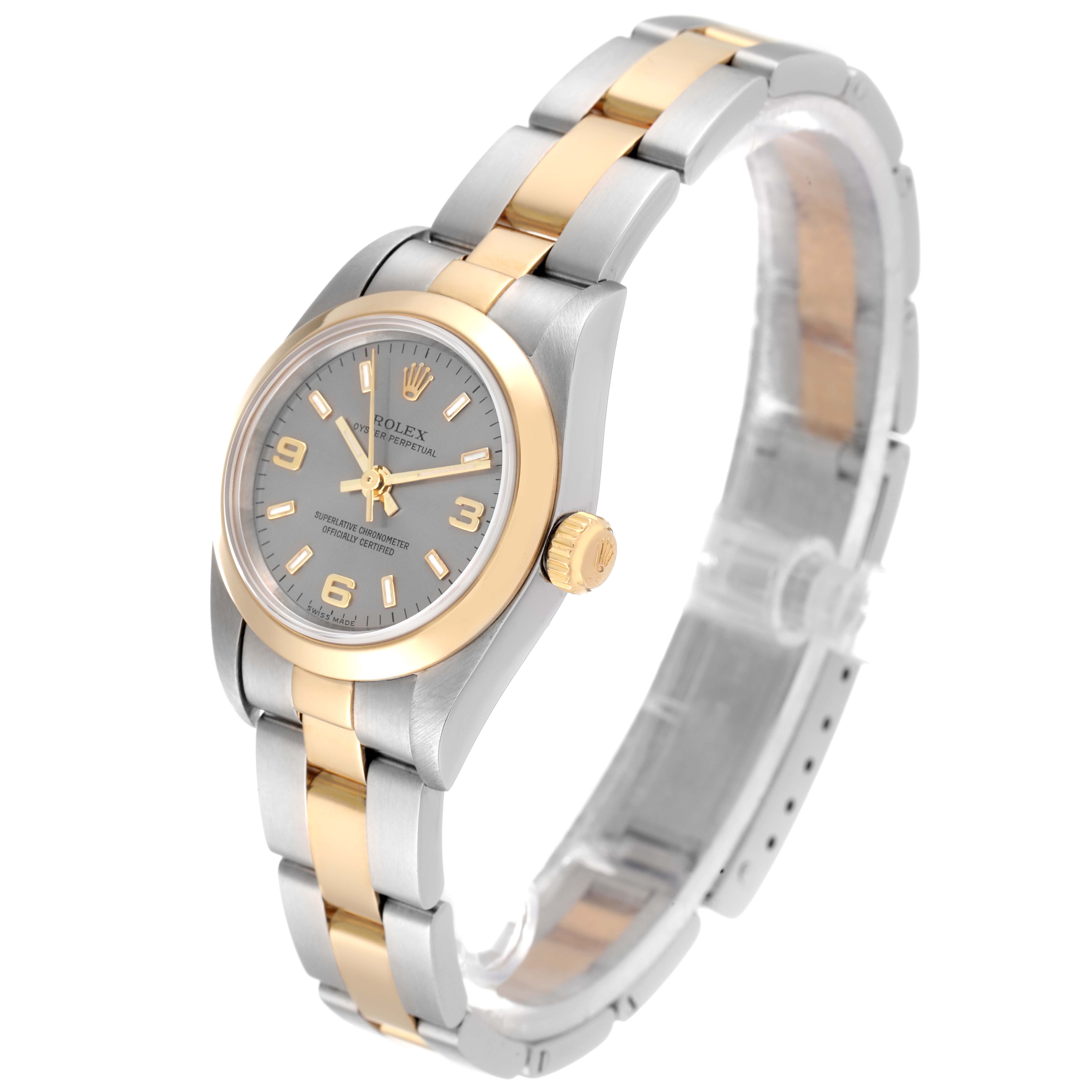 The image shows a Rolex Oyster Perpetual 76183 Women
s Steel and Gold (two tone) Grey Dial 76183 Women
s Steel and Gold (two tone) Grey Dial watch at a slight side angle, displaying the dial, bezel, crown, and bracelet.