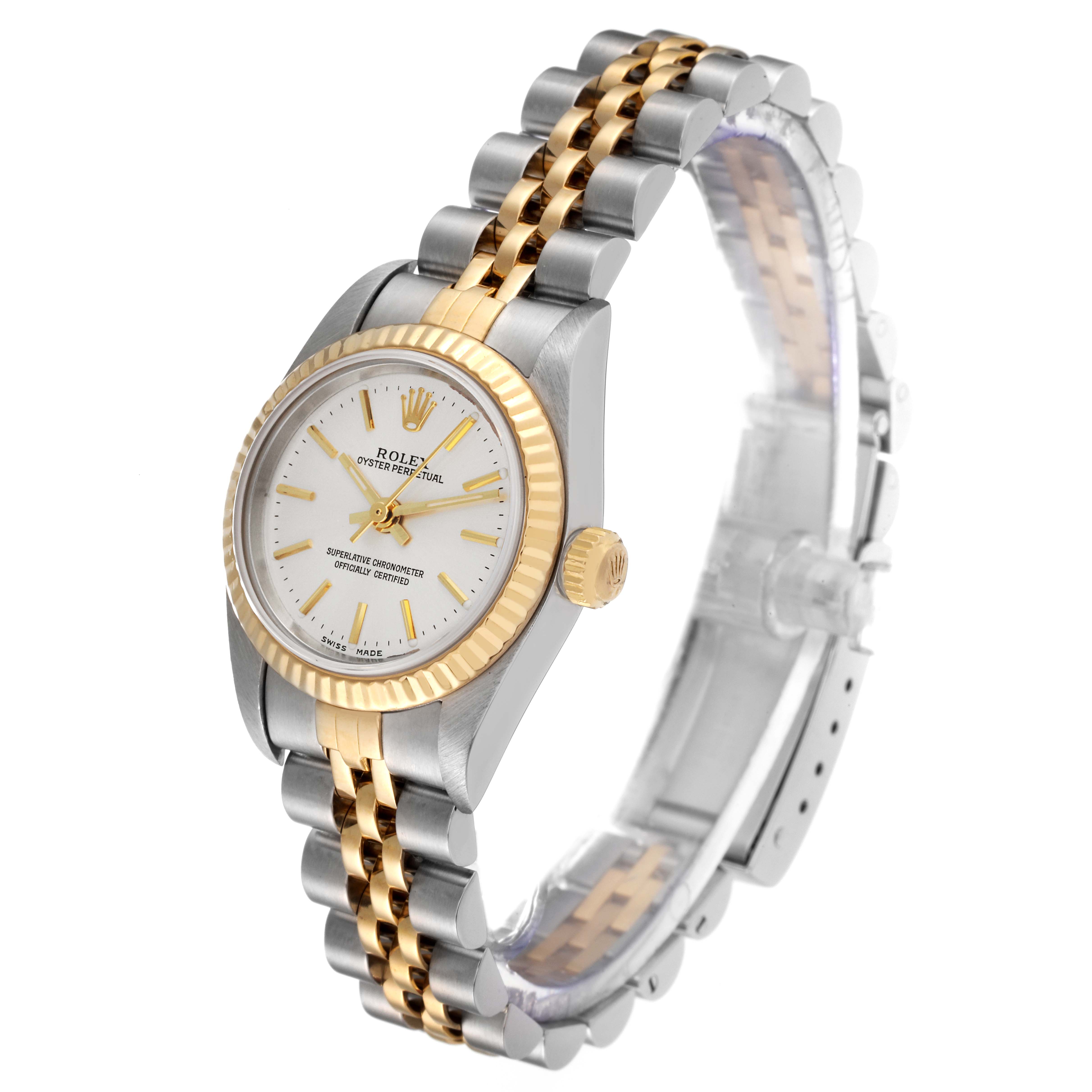 The Rolex Oyster Perpetual 76193 Women's Steel and Gold (two tone) Silver Dial 76193 Women's Steel and Gold (two tone) Silver Dial model watch is shown at a slight angle, displaying its gold and silver bracelet, white dial, and gold hour markers.