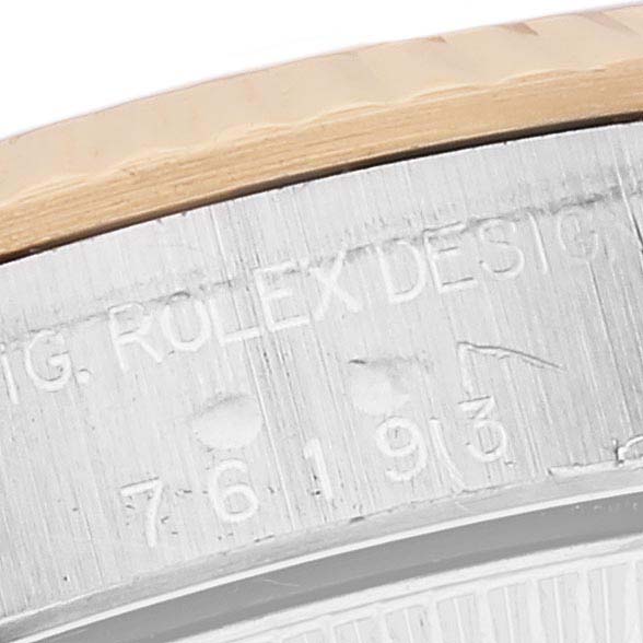This is a close-up view of the casing edge, including the engraved model information of the Rolex Oyster Perpetual 76193 Women's Steel and Gold (two tone) Silver Dial 76193 Women's Steel and Gold (two tone) Silver Dial watch.