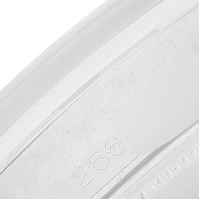 The image shows a close-up of the engraving on the inner bezel of a Rolex Vintage Collection 6694 Men's Stainless Steel Silver Dial 6694 Men's Stainless Steel Silver Dial watch.