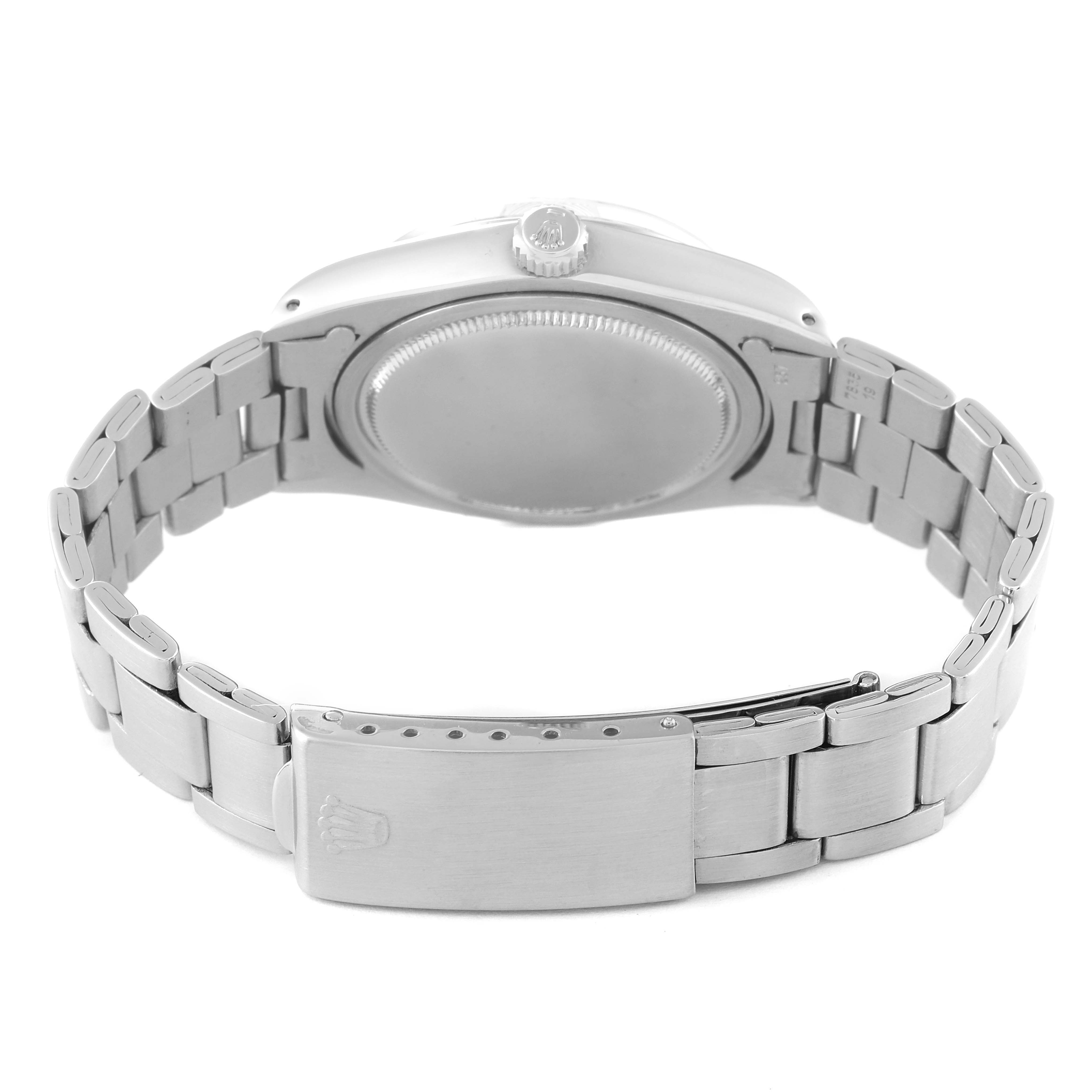 The image shows the back view of the Rolex Vintage Collection 6694 Men's Stainless Steel Silver Dial 6694 Men's Stainless Steel Silver Dial watch, focusing on the case back and the metal bracelet with a clasp.