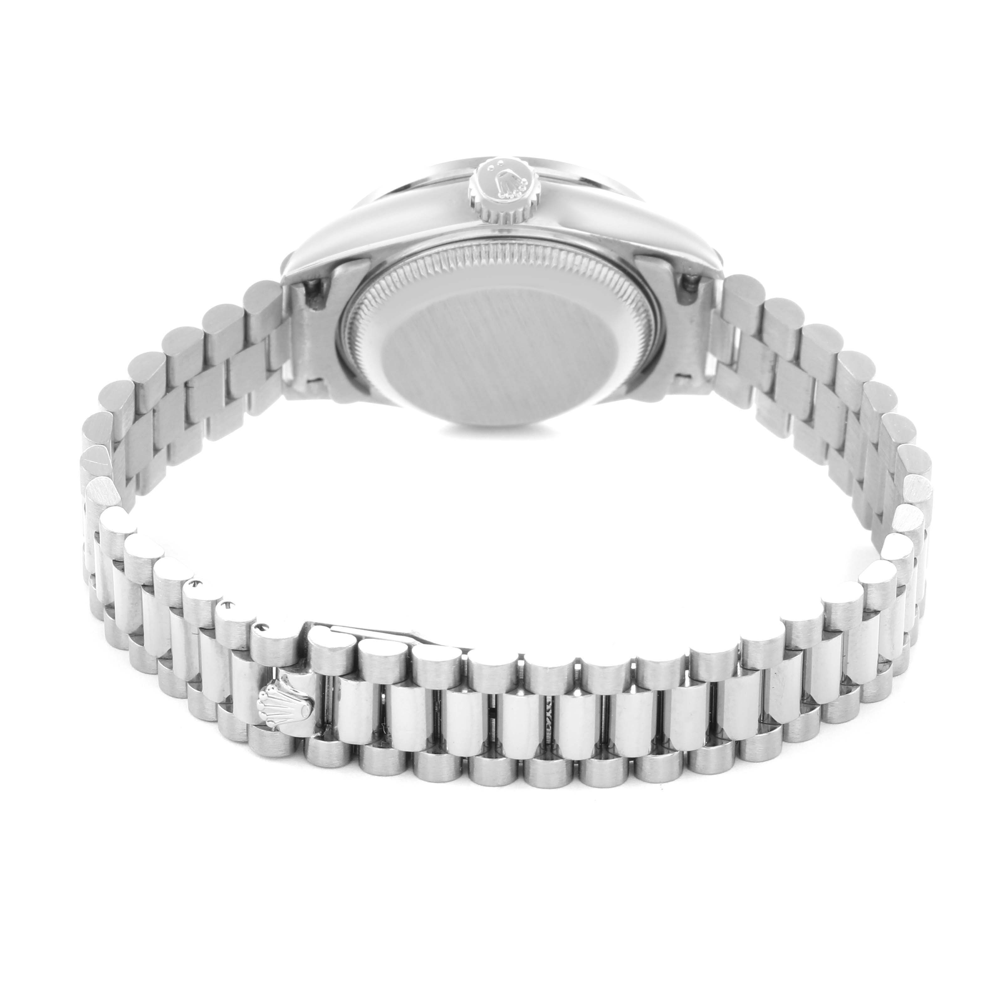 The Rolex President 69079 Women
s White Gold Silver Dial 69079 Women
s White Gold Silver Dial watch is shown from the back, featuring the case back, crown, and the full bracelet.