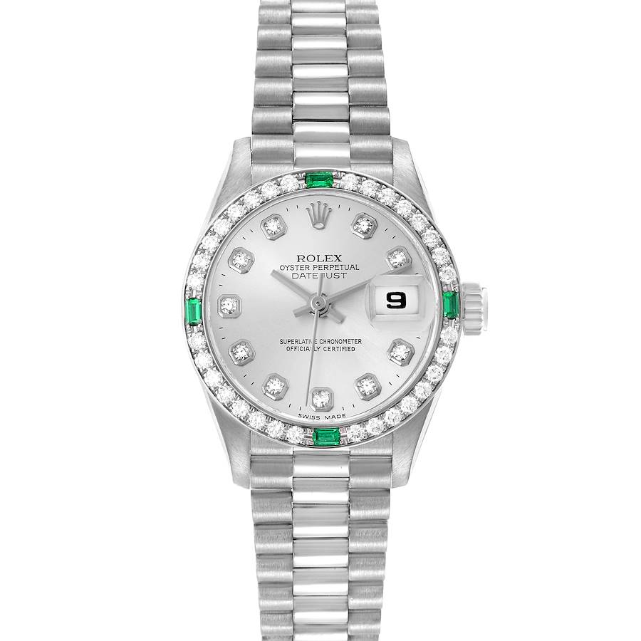The Rolex President model is shown from a top view, displaying its silver dial, diamond bezel, and bracelet.