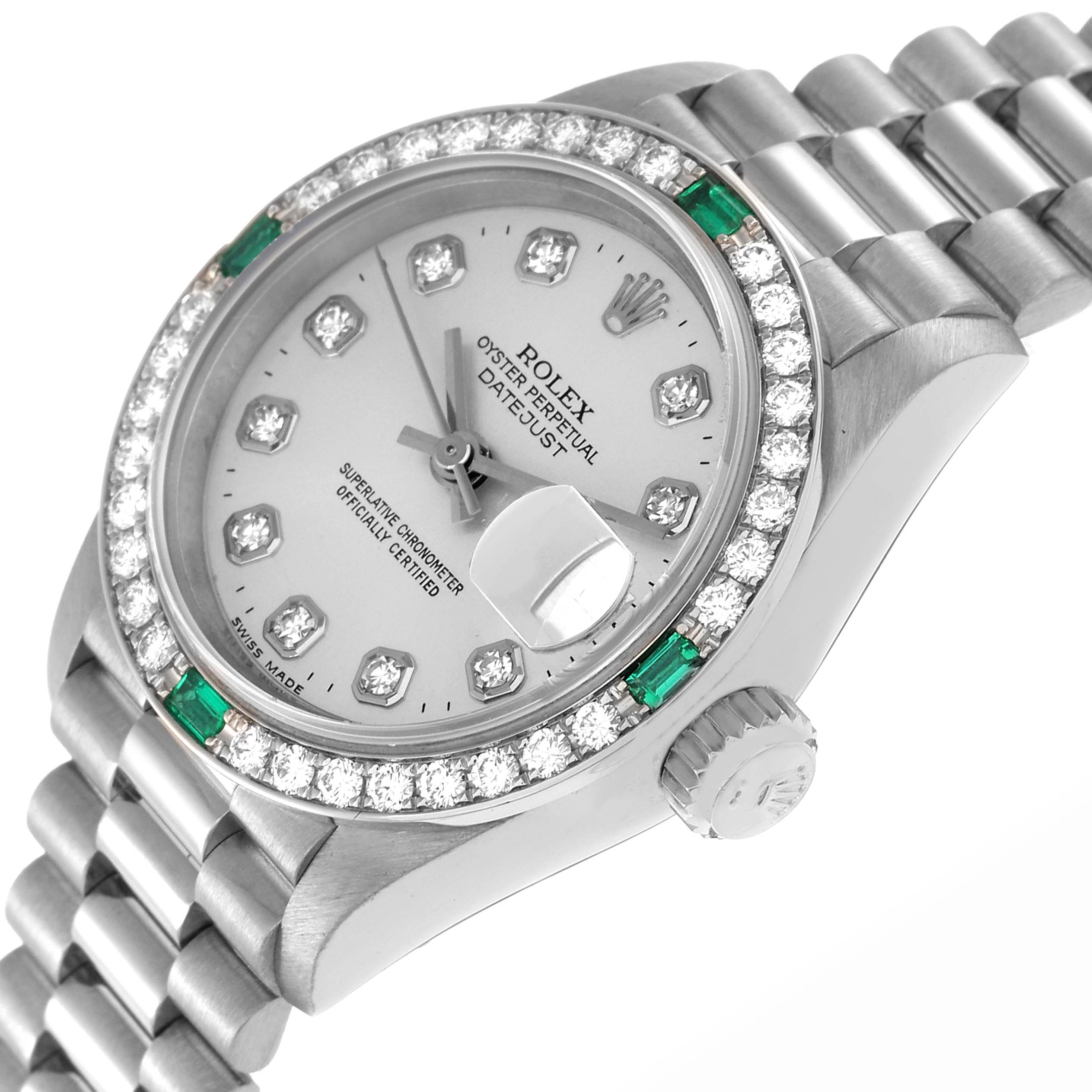 The Rolex President 69079 Women
s White Gold Silver Dial 69079 Women
s White Gold Silver Dial model watch is shown at an angled view featuring the dial, diamond bezel, crown, and bracelet links.