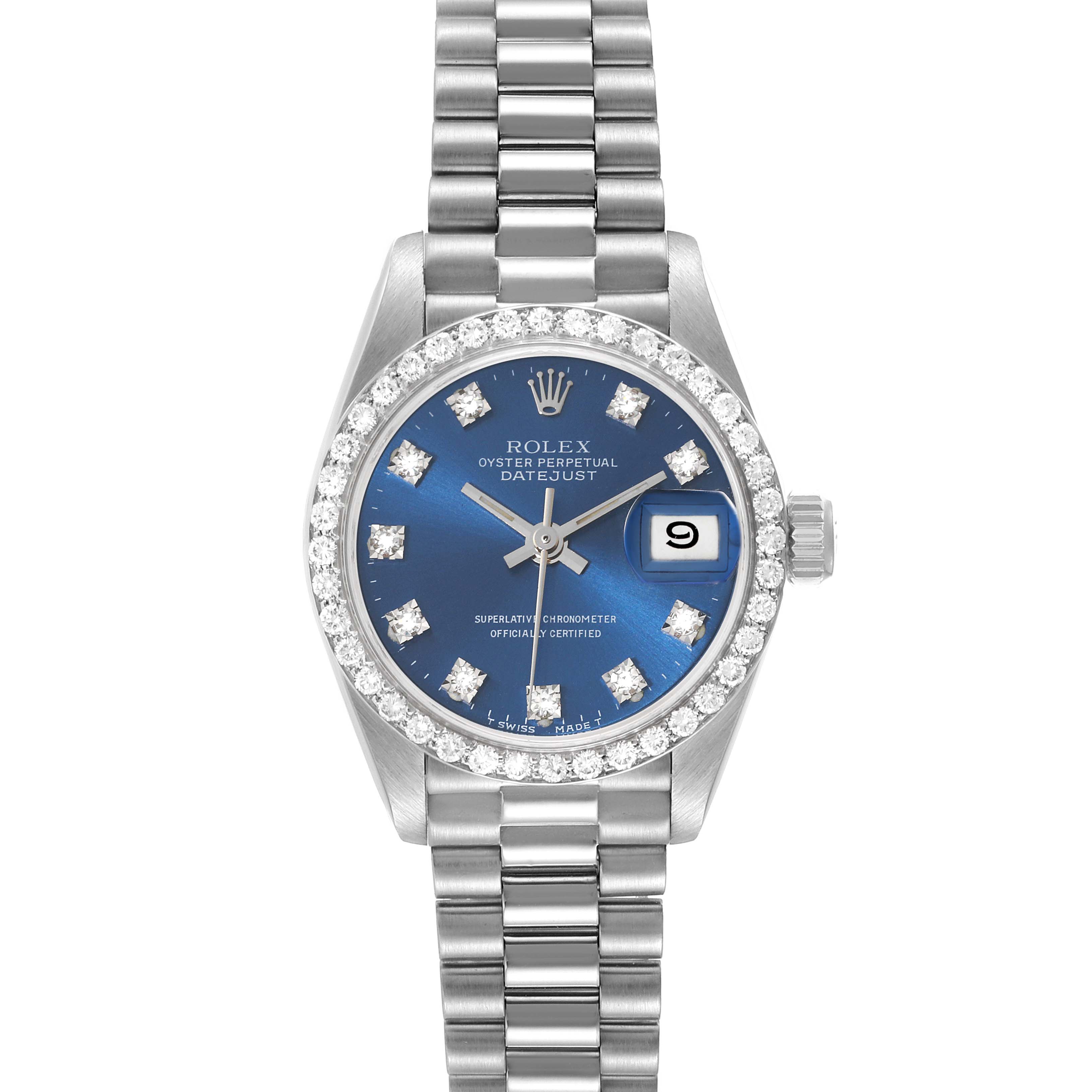 The image shows a frontal view of a Rolex President 69139 Women's White Gold Blue Dial 69139 Women's White Gold Blue Dial model watch, highlighting its blue dial, date function, and diamond bezel.