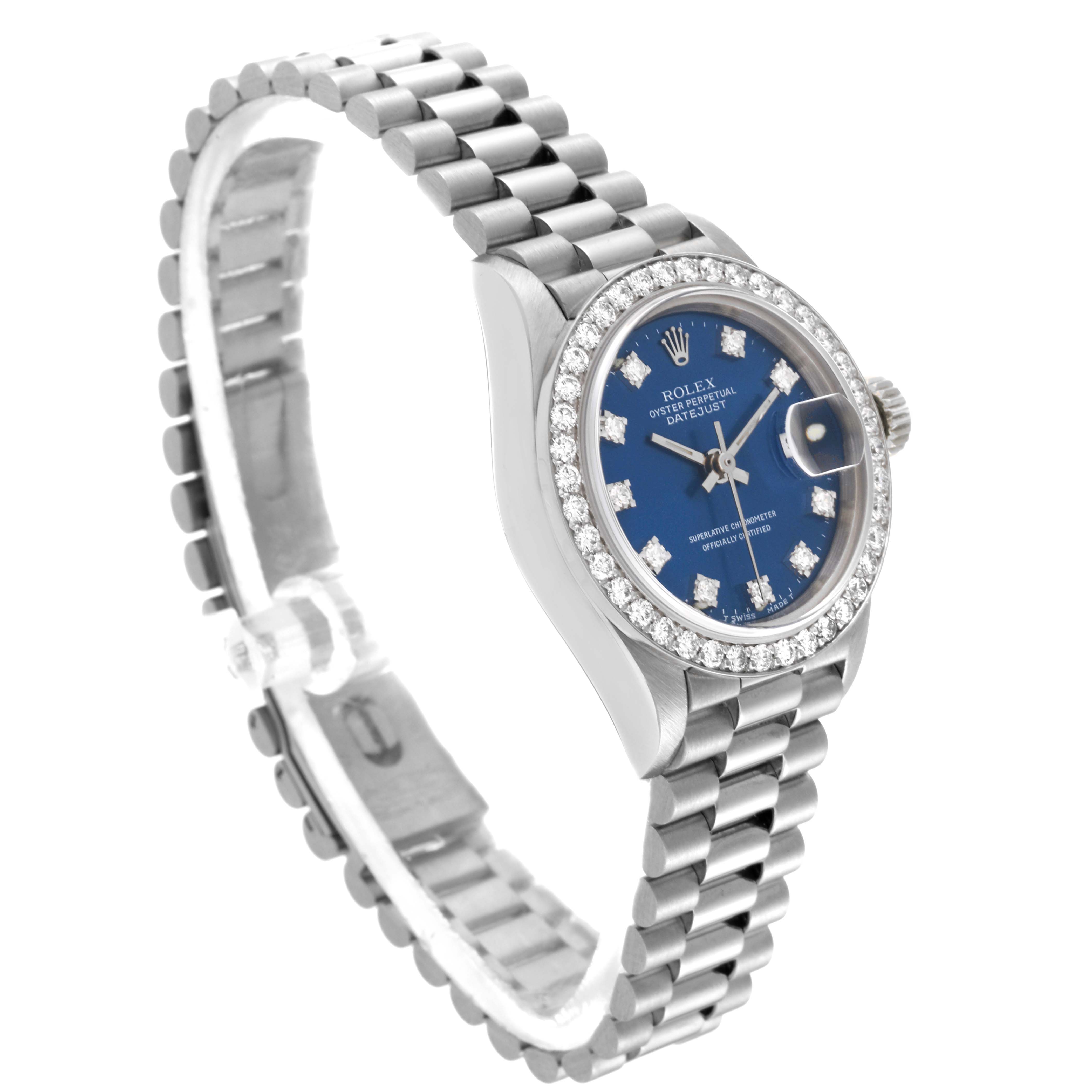 This image shows a side angle of the Rolex President 69139 Women's White Gold Blue Dial 69139 Women's White Gold Blue Dial model, highlighting its blue dial, diamond bezel, and metallic bracelet.