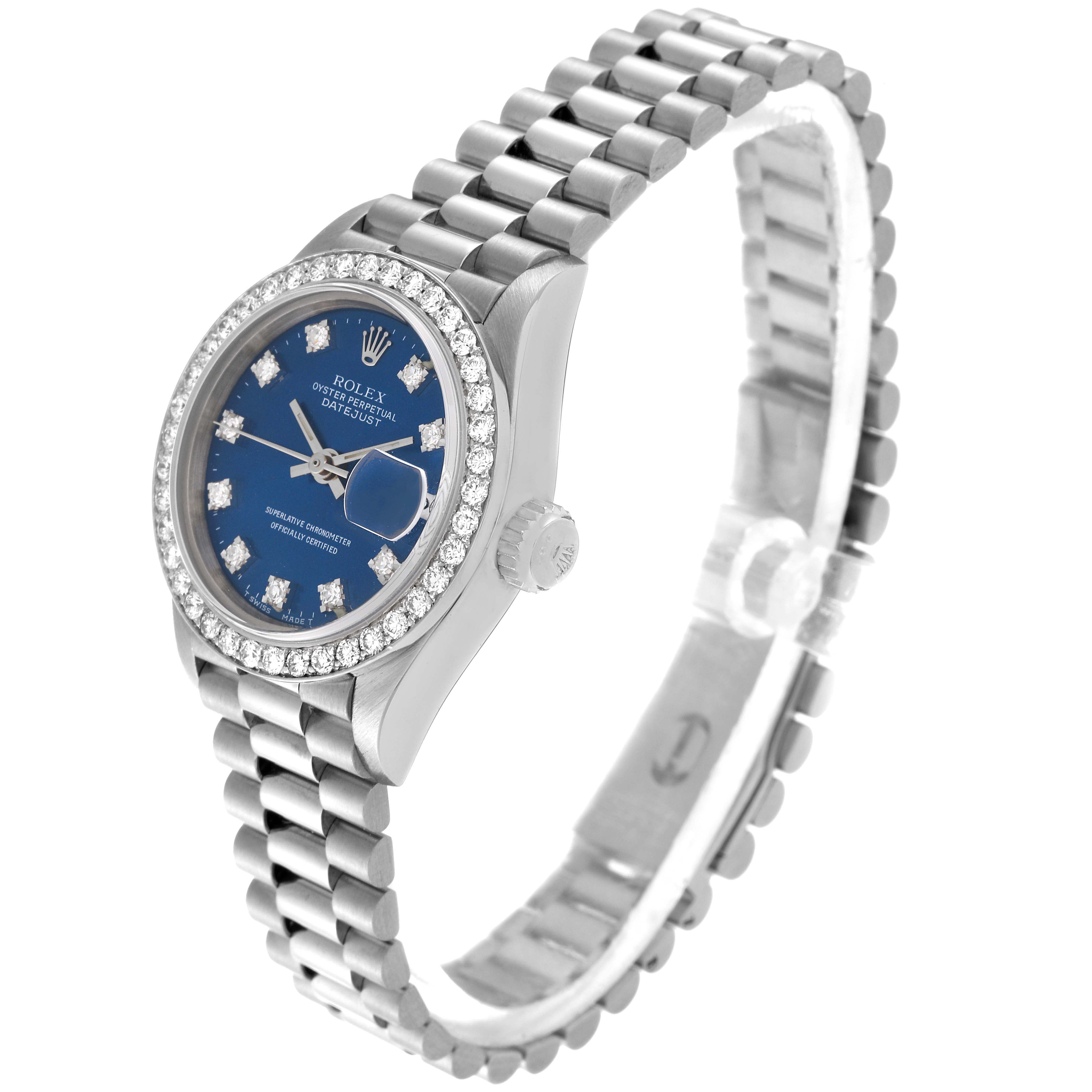 The image shows a Rolex President 69139 Women's White Gold Blue Dial 69139 Women's White Gold Blue Dial model watch with a blue dial, diamond bezel, and a silver metal bracelet, viewed from a front-side angle.