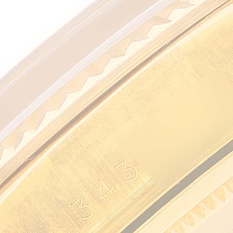 This close-up view of the Rolex President 1803 Men's Yellow Gold Champagne Dial 1803 Men's Yellow Gold Champagne Dial model watch shows a portion of the bezel with a visible serial number.