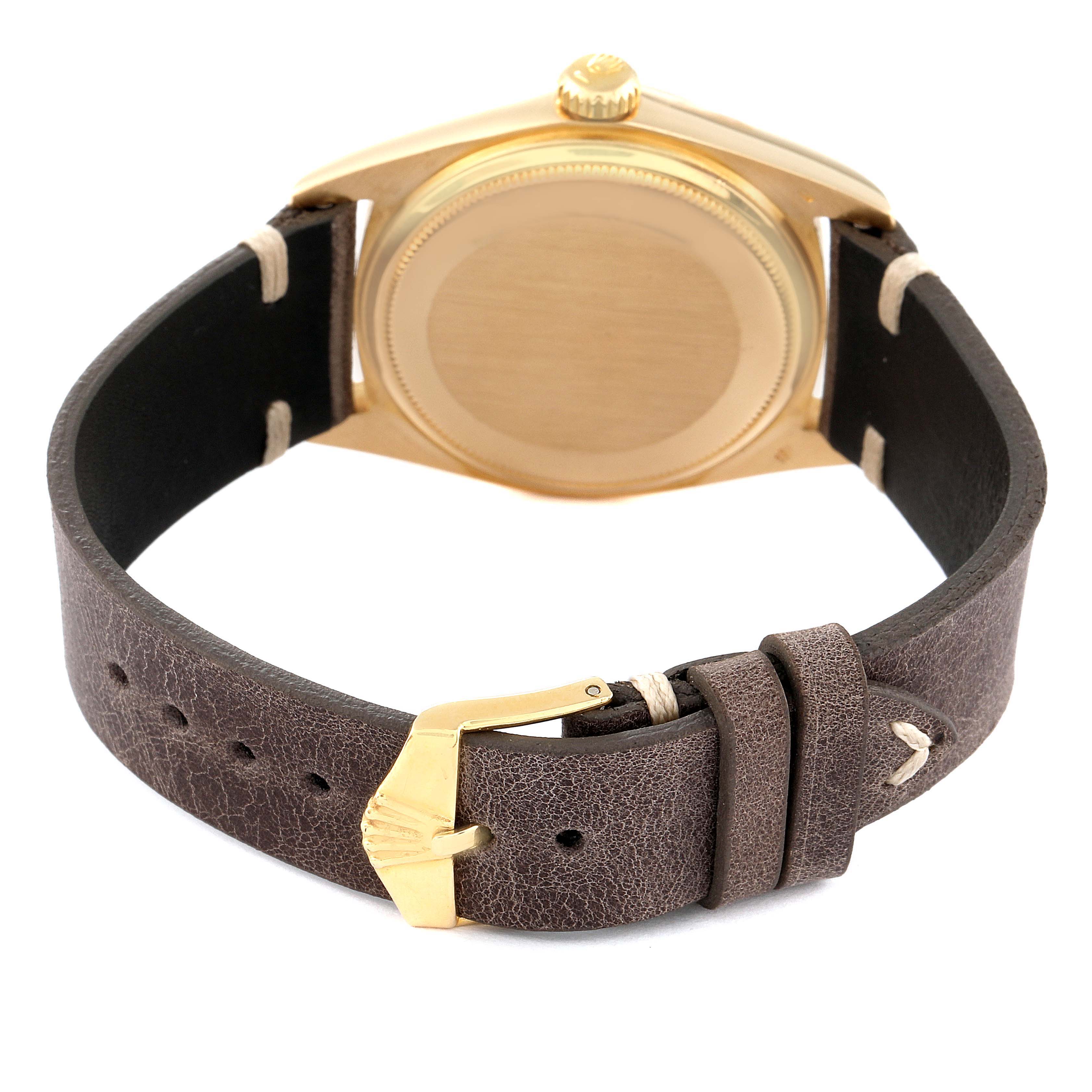 The image shows the back of the Rolex President 1803 Men's Yellow Gold Champagne Dial 1803 Men's Yellow Gold Champagne Dial model watch, focusing on the case and the leather strap with a golden buckle.