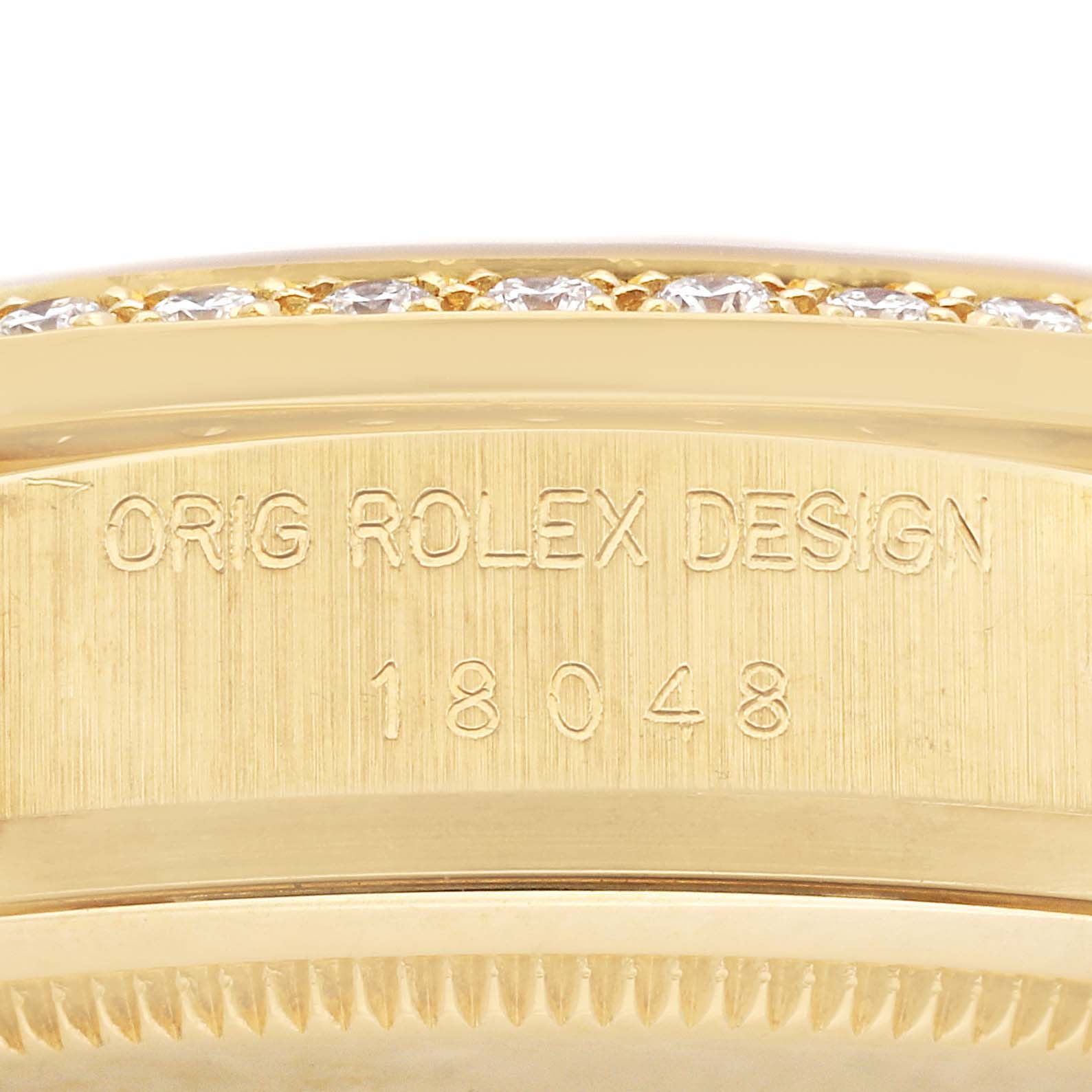 This image shows a close-up of the case side with the engravings on a Rolex President 18048A Men
s Yellow Gold Champagne Dial 18048A Men
s Yellow Gold Champagne Dial model watch.