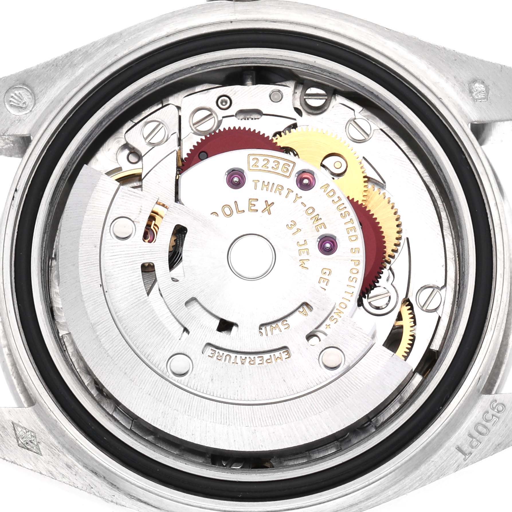 The image shows the movement of a Rolex President 279136 Women's Platinum Blue Dial 279136 Women's Platinum Blue Dial model from a top-down angle, highlighting gears and mechanisms.