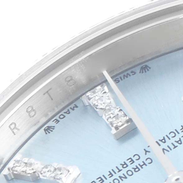 The image shows a close-up of the dial and bezel of a Rolex President 279136 Women's Platinum Blue Dial 279136 Women's Platinum Blue Dial watch, highlighting diamond hour markers and the edge of the casing.