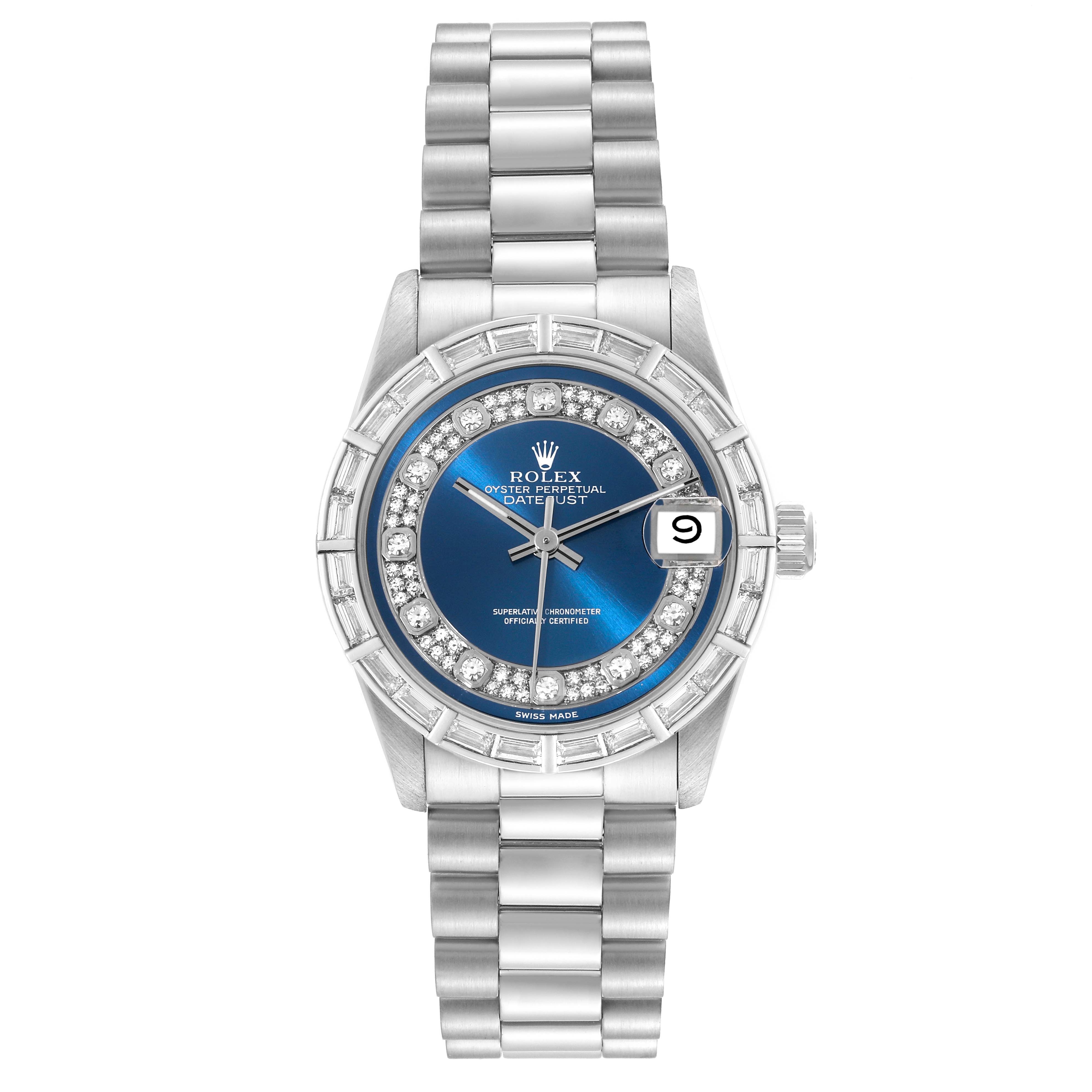 The Rolex President 68266 Women
s Platinum Blue Dial 68266 Women
s Platinum Blue Dial model watch is shown from a front angle, displaying its face, bracelet, date window, and diamond bezel.