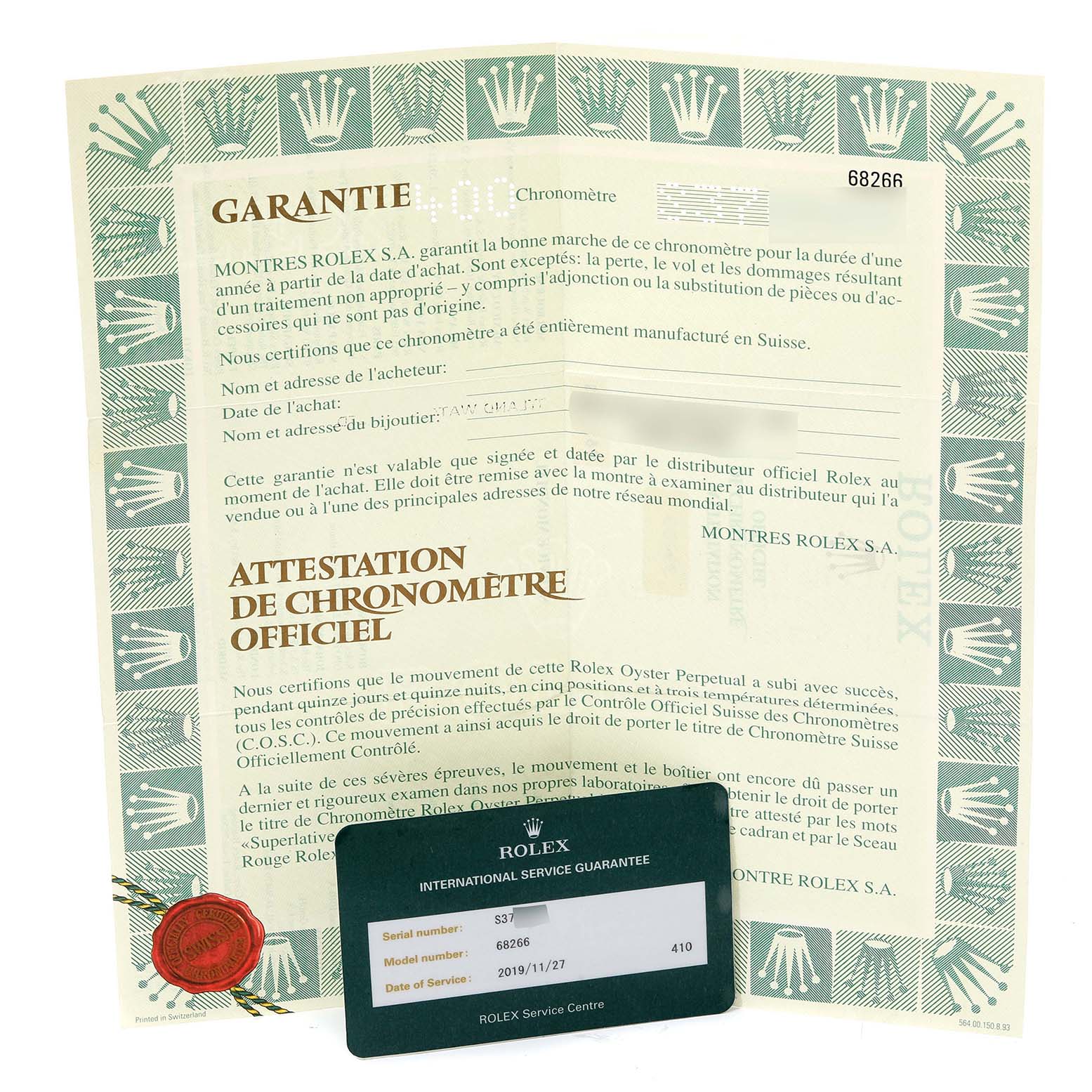 The image shows the guarantee and chronometer certification documents for a Rolex President 68266 Women
s Platinum Blue Dial 68266 Women
s Platinum Blue Dial model watch, along with the international service guarantee card.