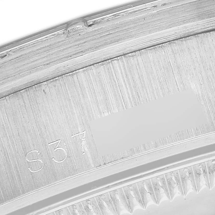 This close-up image shows the outer rim near the bezel of the Rolex President 68266 Women
s Platinum Blue Dial 68266 Women
s Platinum Blue Dial model watch.