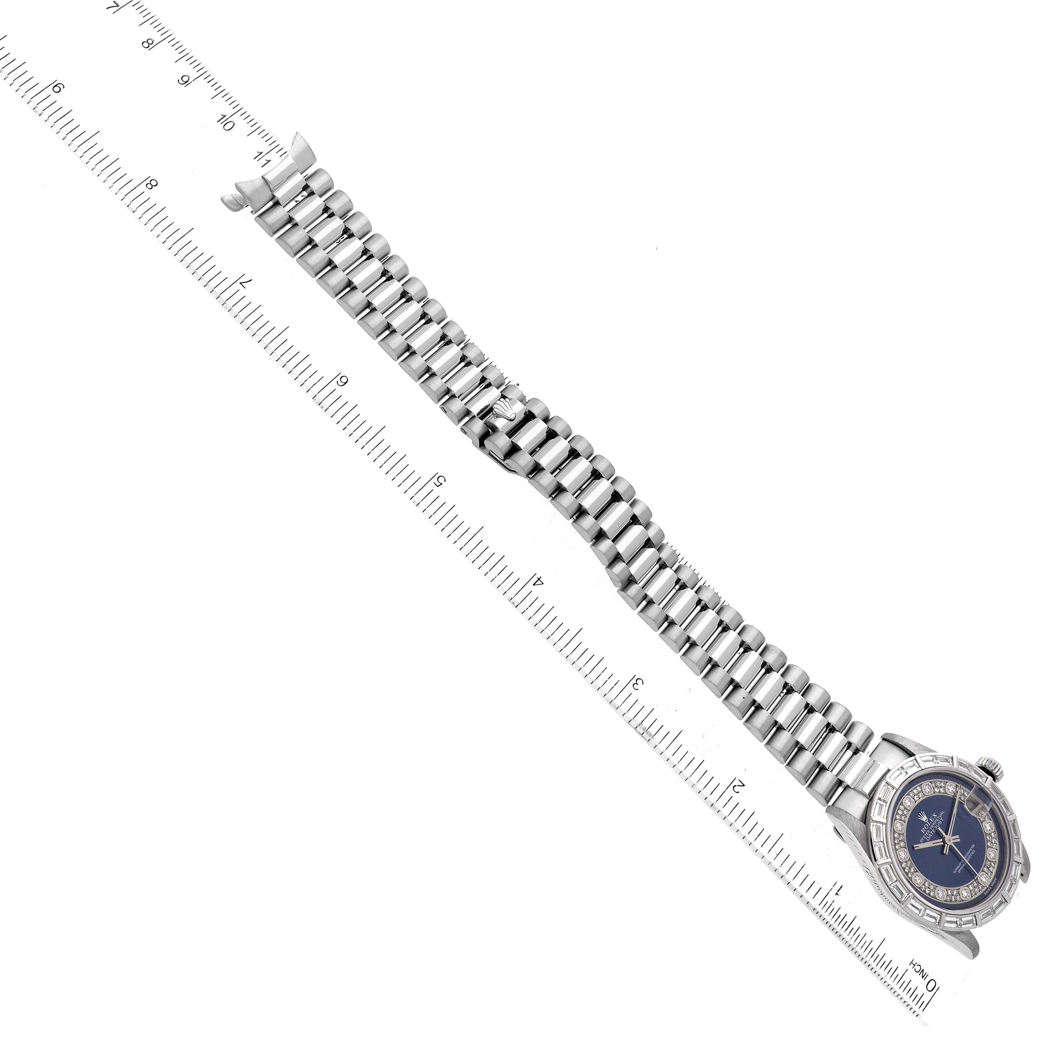 This image shows a Rolex President 68266 Women
s Platinum Blue Dial 68266 Women
s Platinum Blue Dial model watch from an overhead angle, highlighting the full length of the band and the face.