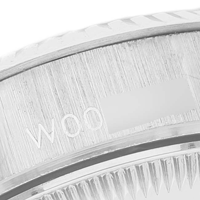 This close-up image of the Rolex President 69179 Women's White Gold Blue Dial 69179 Women's White Gold Blue Dial model watch highlights the edge of the watch bezel.